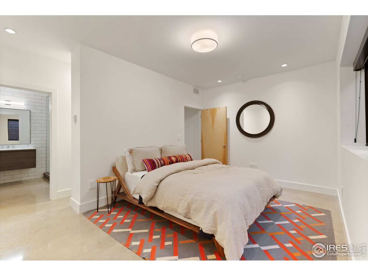 550 Iris Avenue Boulder, CO 80304 - Photo 30 of 39 a living room with a bed and cabinets