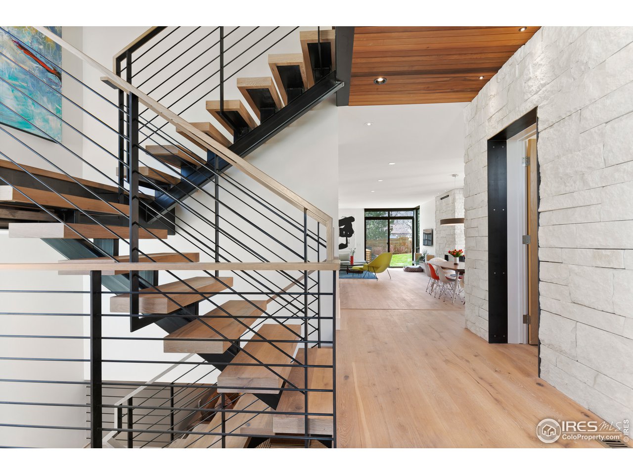 550 Iris Avenue Boulder, CO 80304 - Photo 3 of 39 a view of living room kitchen and entryway