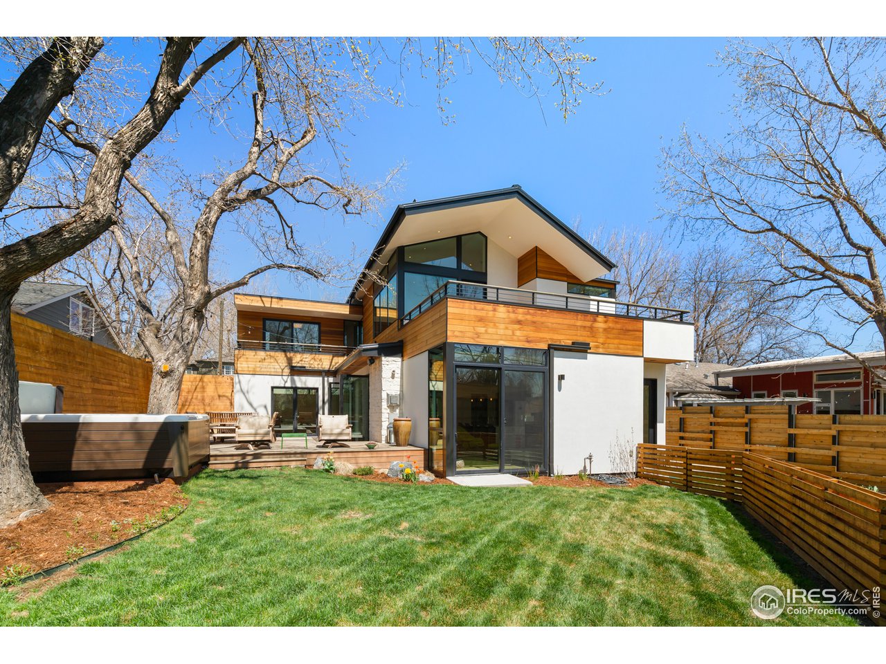 550 Iris Avenue Boulder, CO 80304 - Photo 36 of 39 a view of a house with a yard