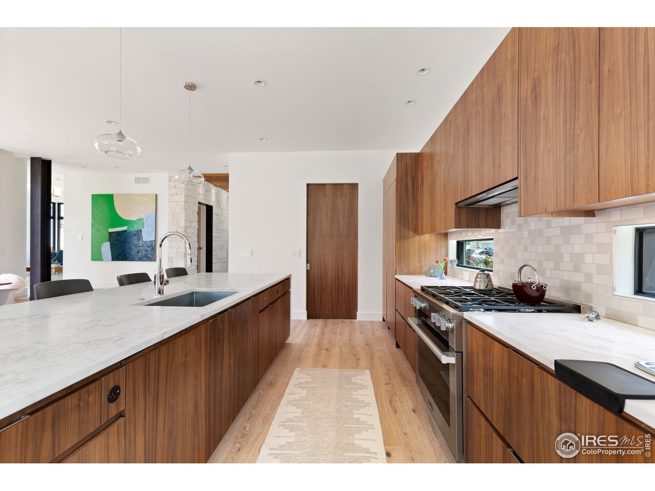 550 Iris Avenue Boulder, CO 80304 - Photo 6 of 39 a kitchen with stainless steel appliances a sink stove and cabinets
