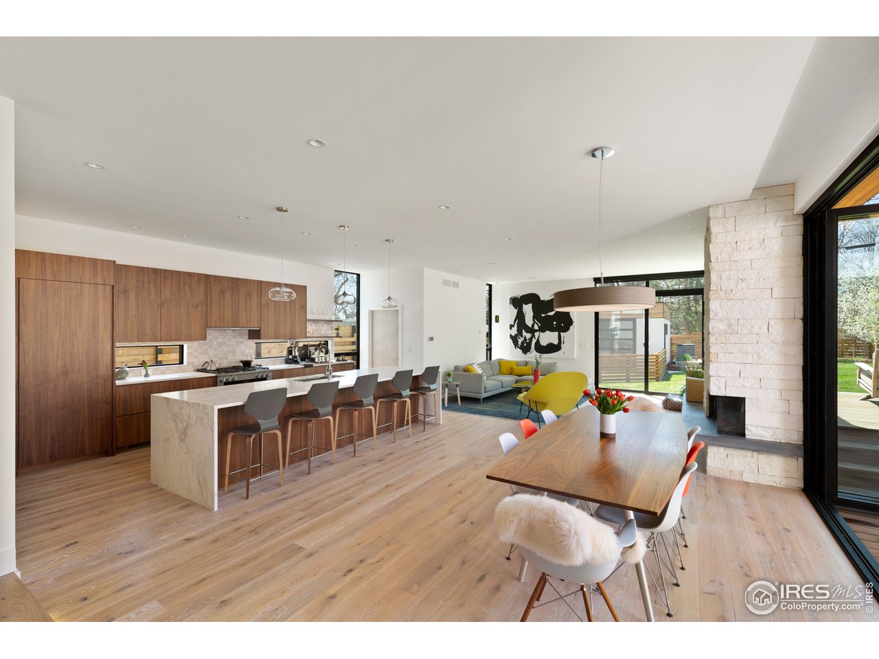 550 Iris Avenue Boulder, CO 80304 - Photo 8 of 39 a living room with stainless steel appliances furniture a rug kitchen view and a large window