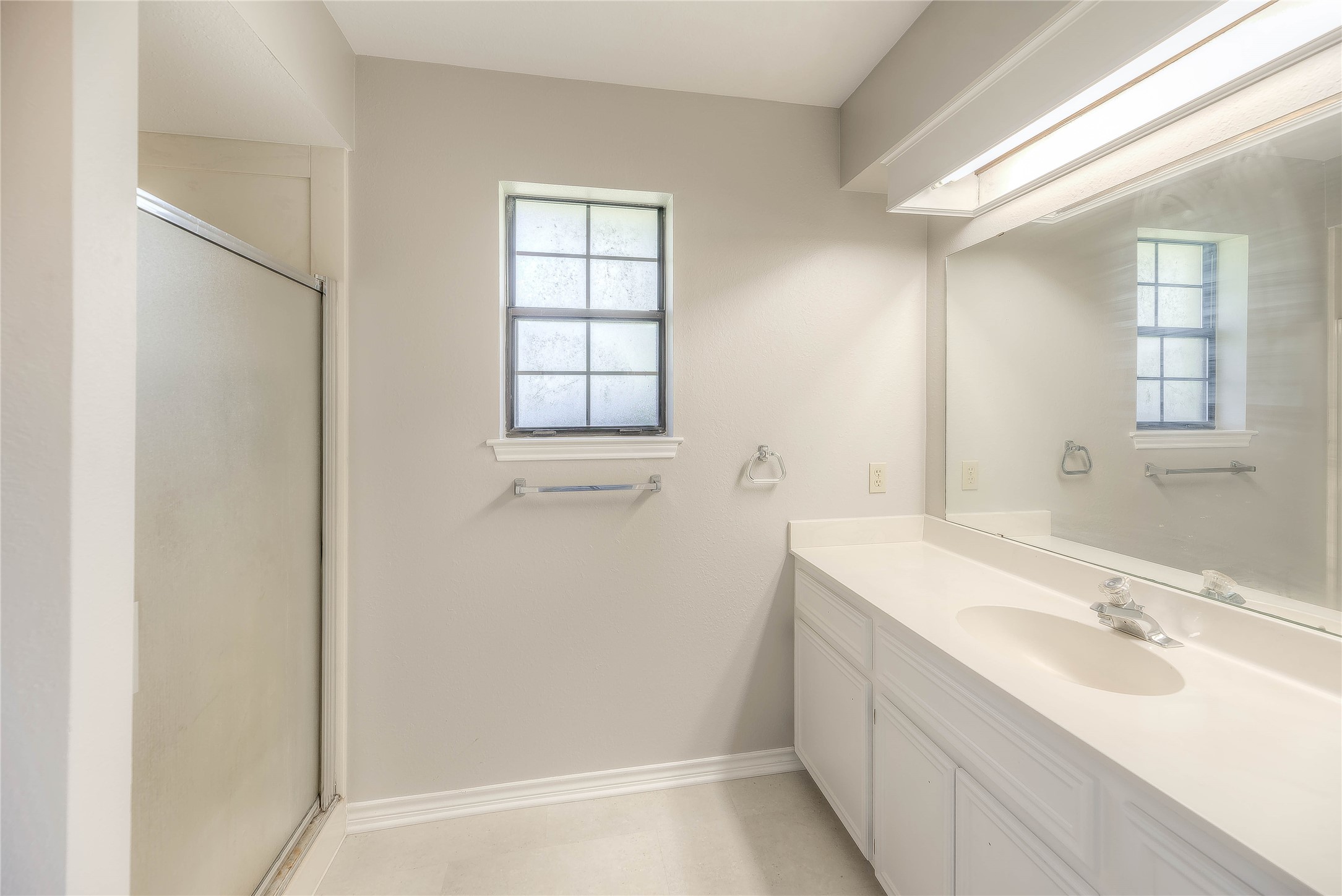 438 Bird Road Livingston, TX 77351 - Photo 15 of 37 a bathroom with a sink and a mirror