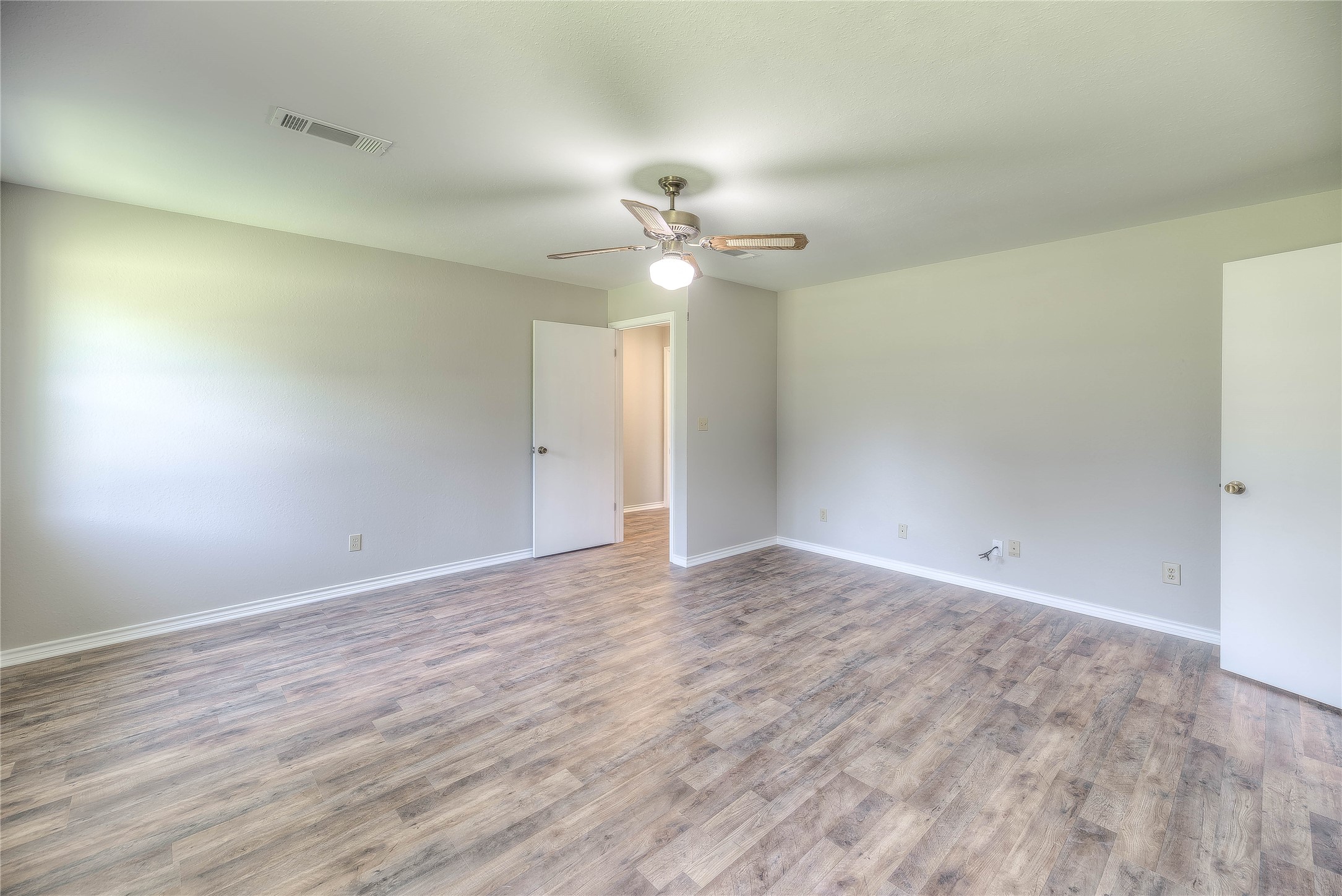 438 Bird Road Livingston, TX 77351 - Photo 16 of 37 wooden floor in an empty room