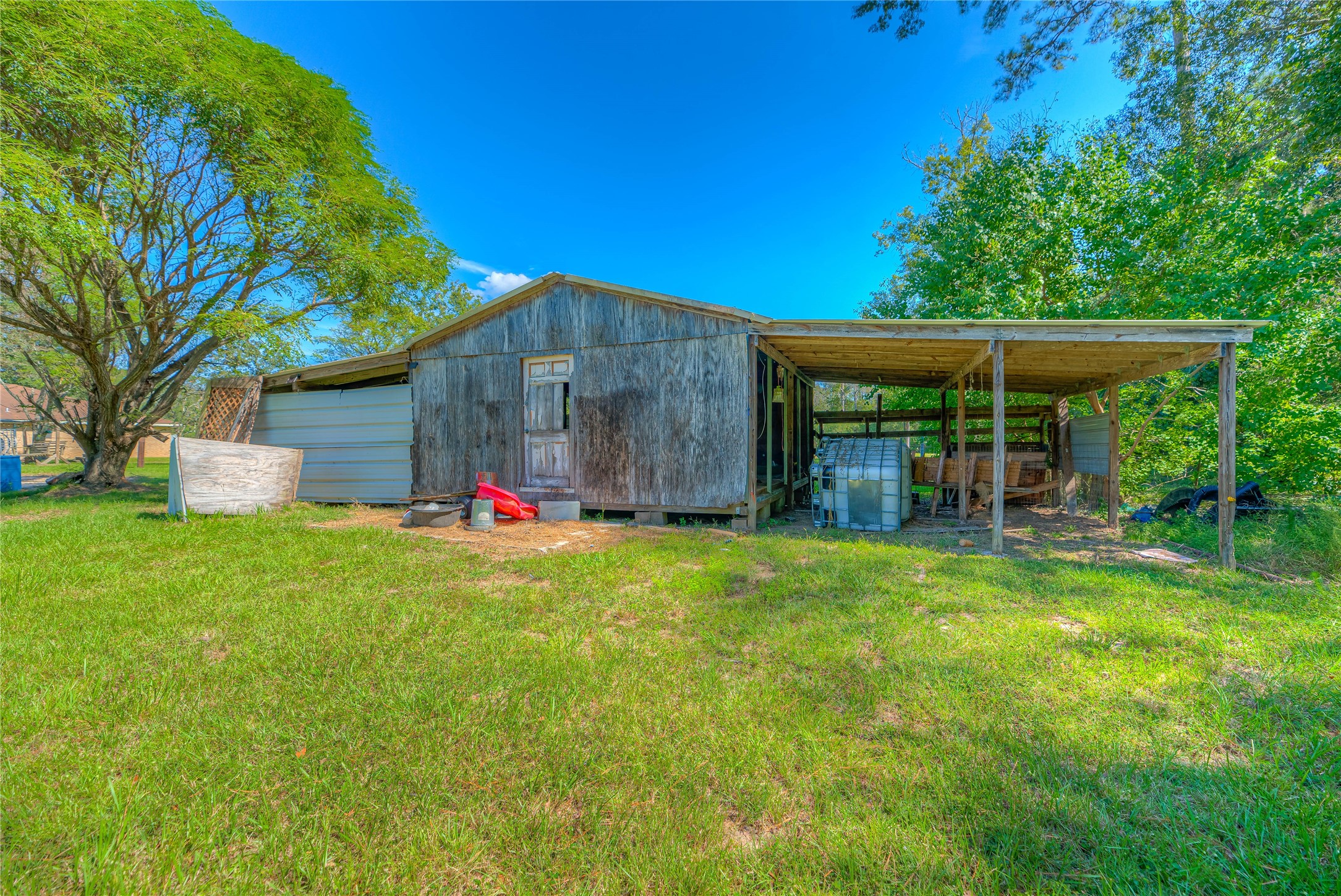 438 Bird Road Livingston, TX 77351 - Photo 27 of 37 a view of backyard with table and chairs and potted plants
