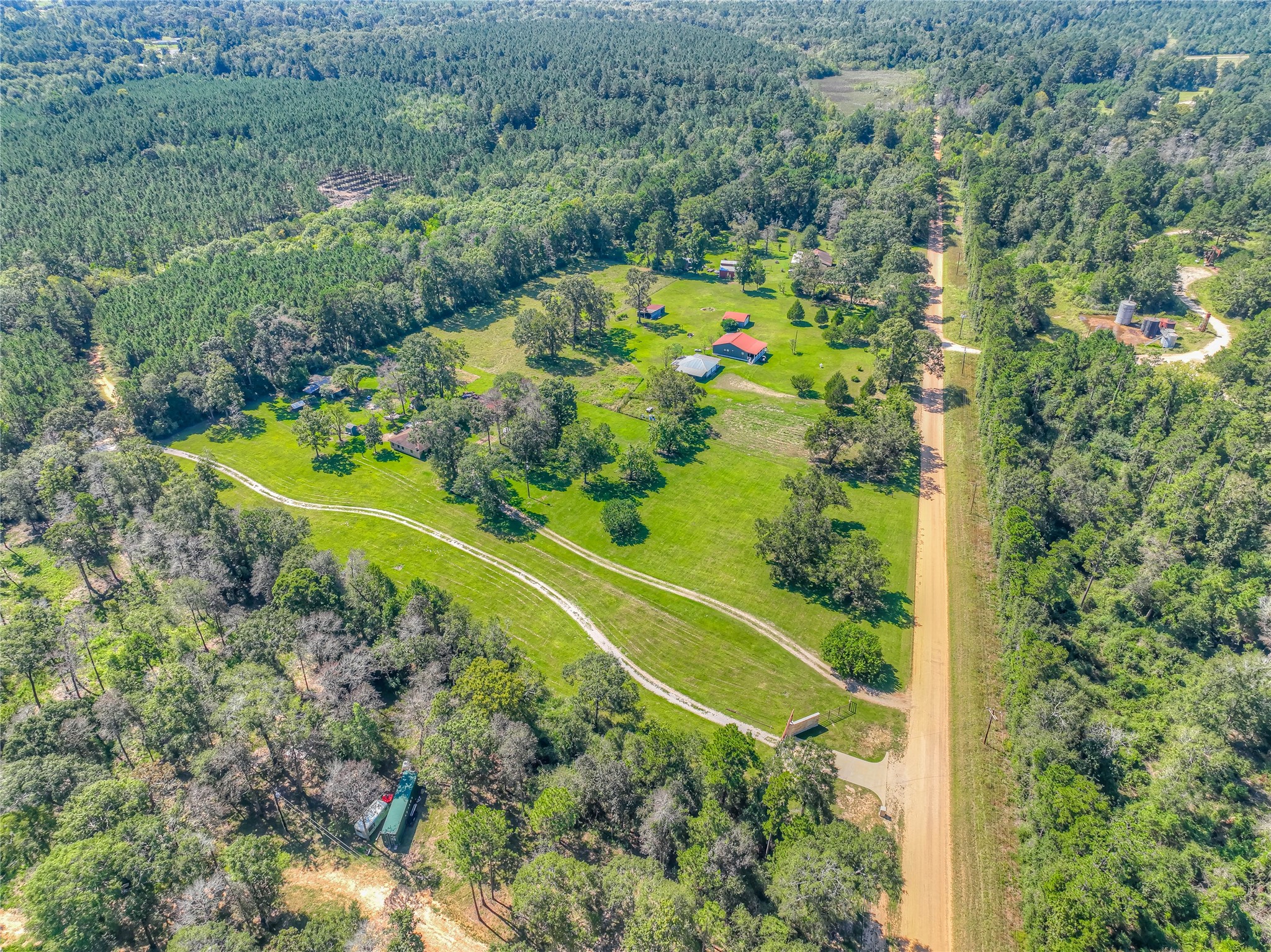 438 Bird Road Livingston, TX 77351 - Photo 30 of 37 an aerial view of a residential houses with outdoor space and trees all around