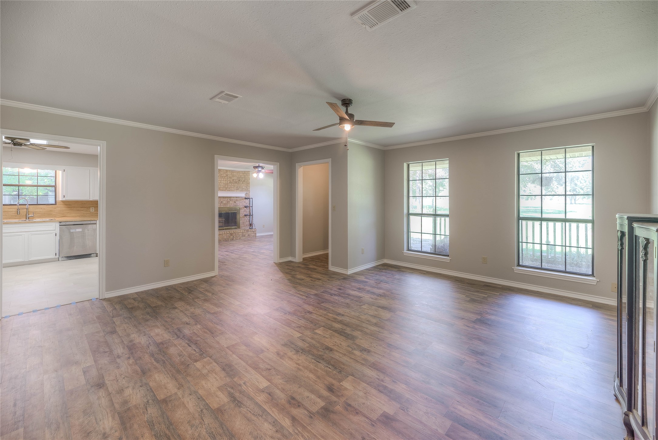 438 Bird Road Livingston, TX 77351 - Photo 3 of 37 an empty room with wooden floor and windows