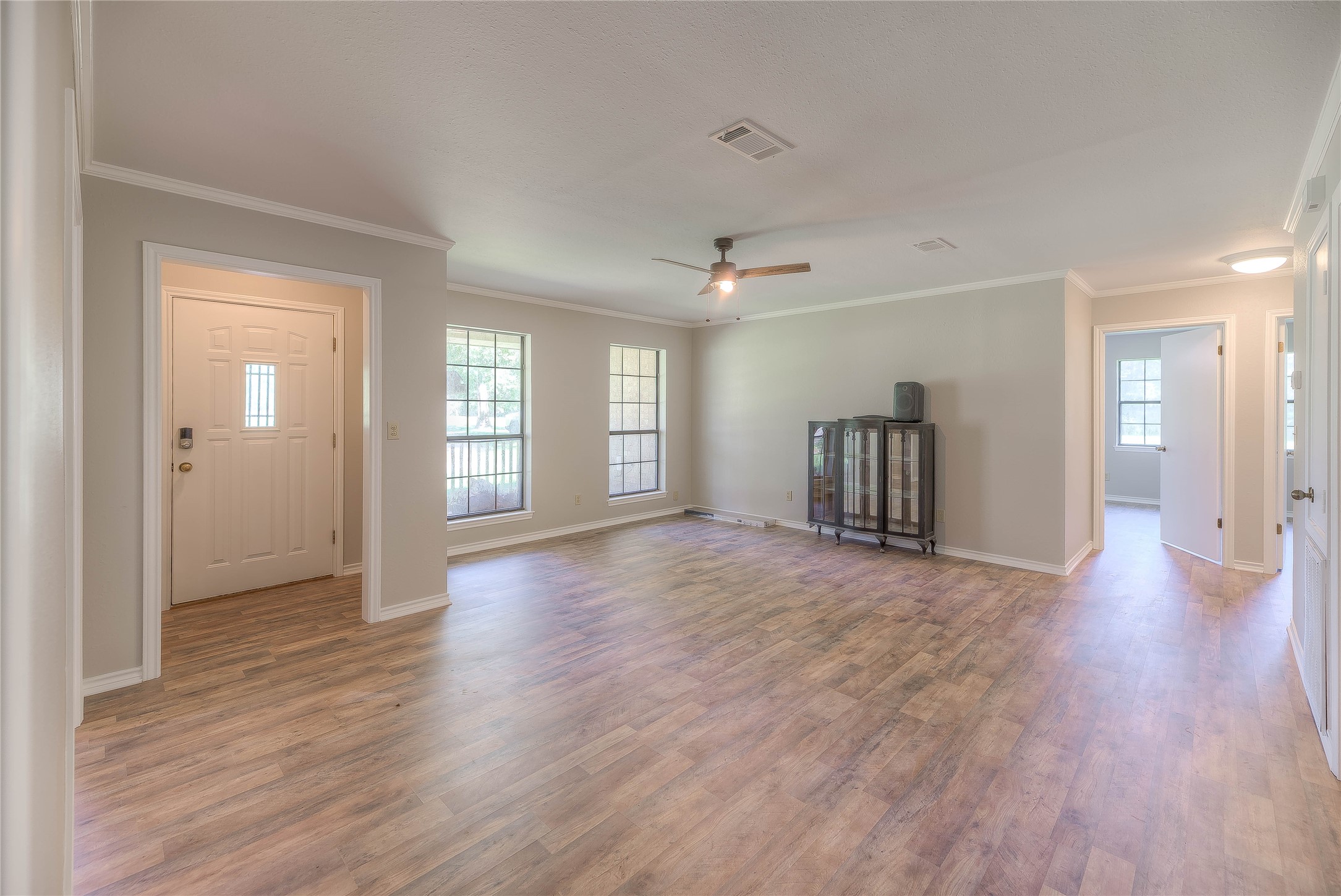 438 Bird Road Livingston, TX 77351 - Photo 4 of 37 a view of a livingroom with wooden floor and a window
