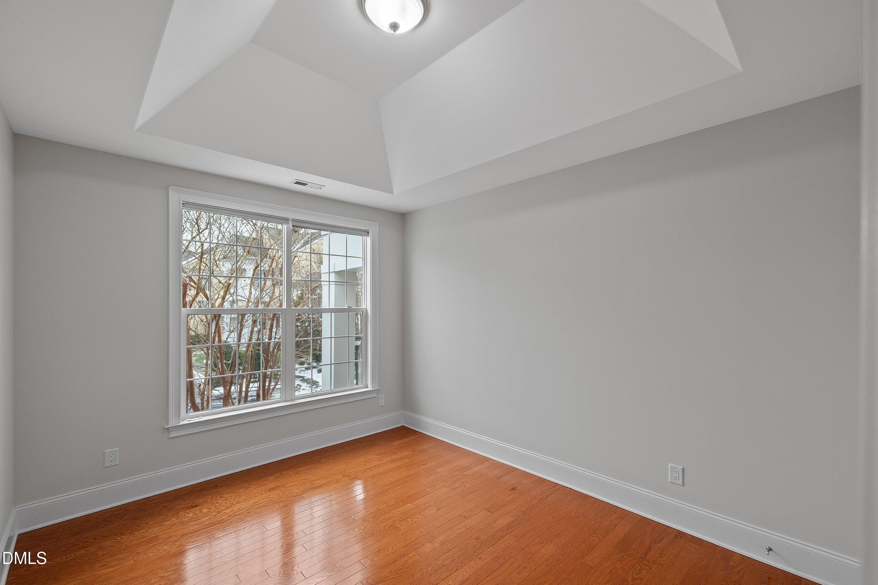 9211 Calabria Drive, Unit 205 Raleigh, NC 27617 - Photo 27 of 55 an empty room with a window