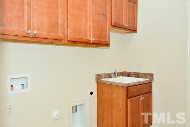 75 Whistling Straight Road, Unit 69 Pinehurst, NC 28374 - Photo 15 of 20 A utility sink, plenty of cabinets, and room for a full size washer/dryer make this an attractive and useful separate Laundry Room.