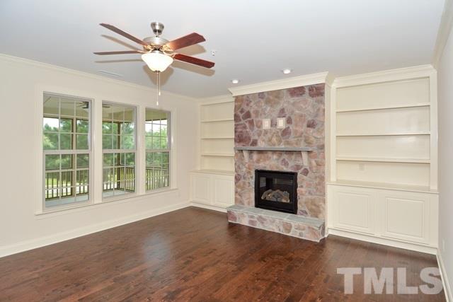 75 Whistling Straight Road, Unit 69 Pinehurst, NC 28374 - Photo 4 of 20 The Family Room stands out with a field stone fireplace, built-in cabinets, and hardwood floors.