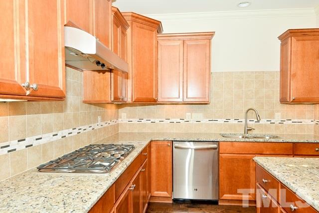 75 Whistling Straight Road, Unit 69 Pinehurst, NC 28374 - Photo 6 of 20 The Kitchen features stainless steel appliances, including a gas cooktop.