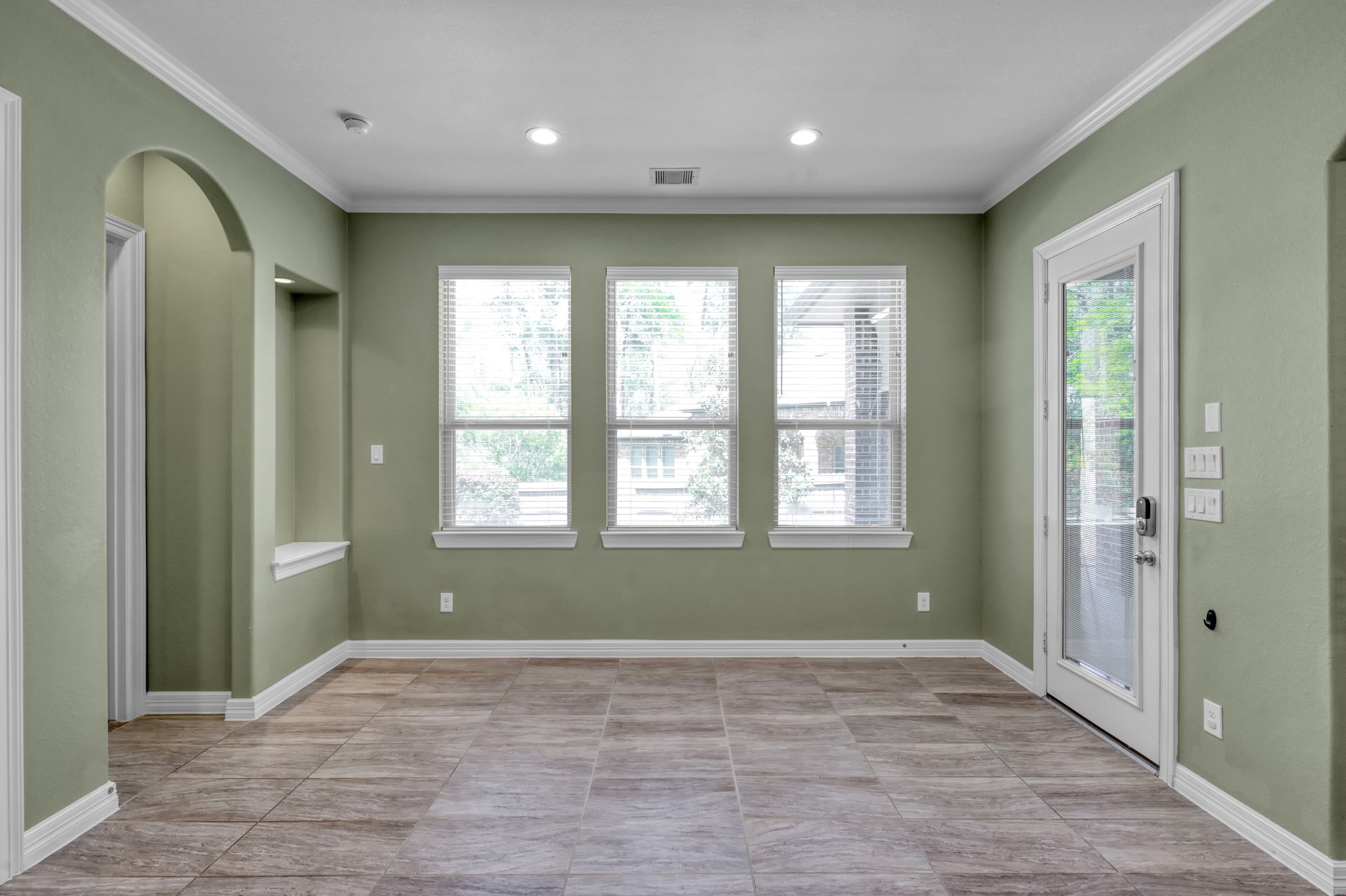 23219 Belted Kingfisher Trail Spring, TX 77389 - Photo 14 of 43 a view of an empty room with wooden floor and a window