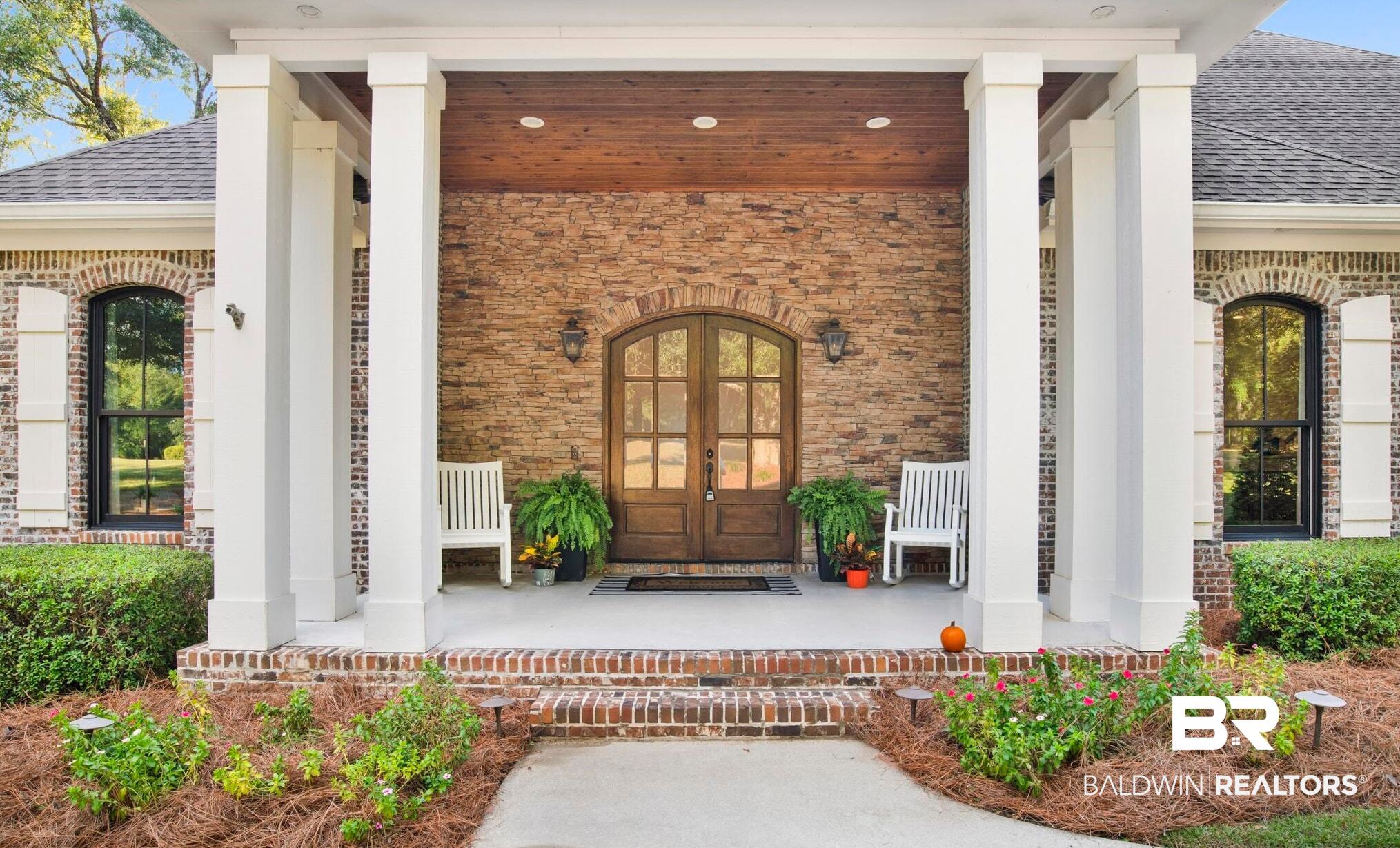11097 Redfern Road Daphne, AL 36526 - Photo 46 of 50 Entrance to property featuring a porch, french doors, a shingled roof, and brick siding