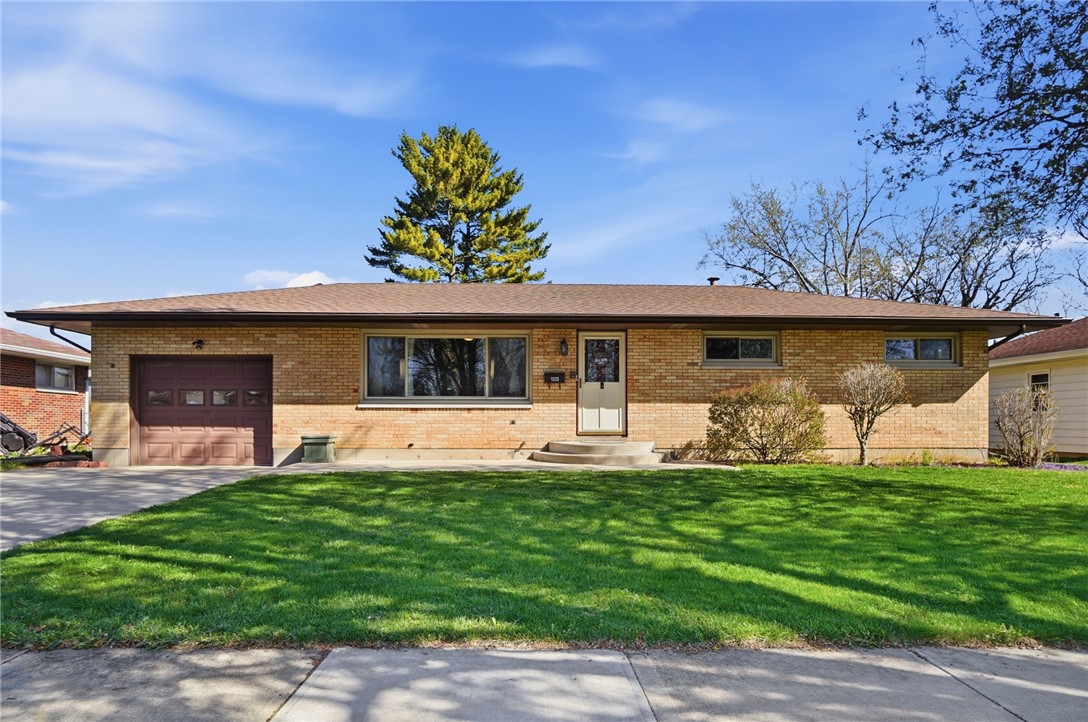 1325 Chelsea Road Troy, OH 45373 - Photo 6 of 42 This classic brick residence features a well-maintained lawn and an inviting facade.
