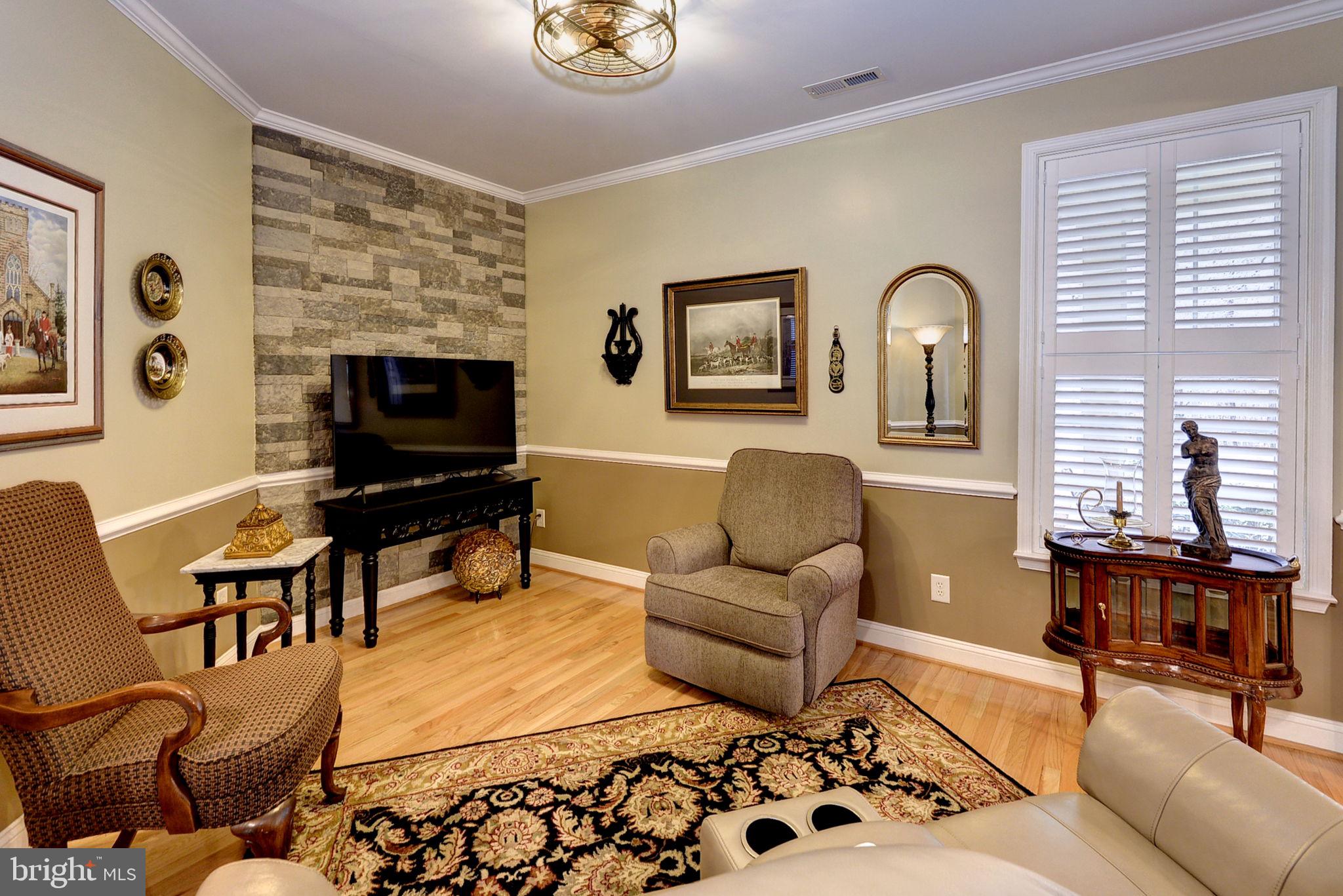 7100 Pinebrook Road Williamsburg, VA 23188 - Photo 12 of 86 a living room with furniture a rug and a window