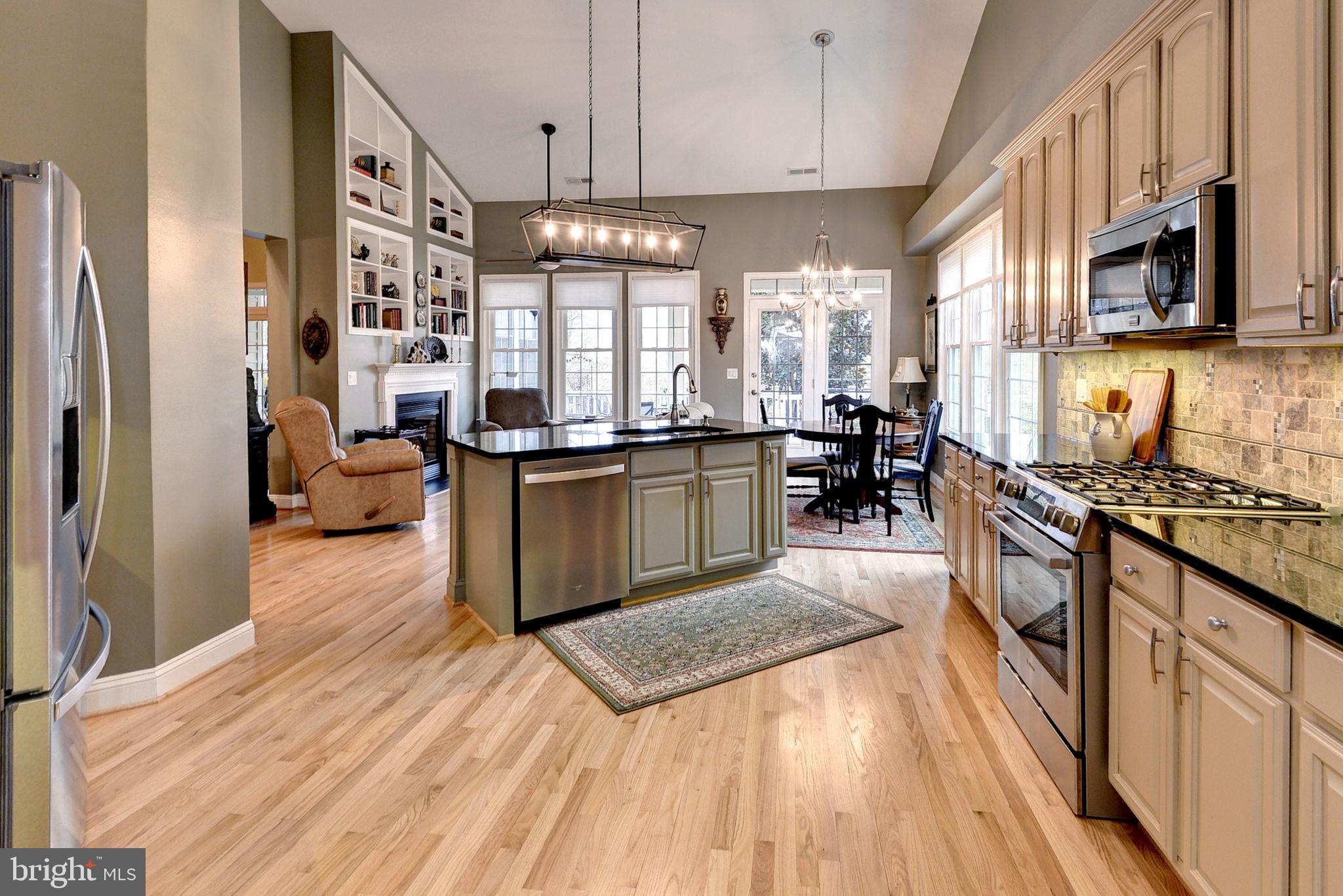 7100 Pinebrook Road Williamsburg, VA 23188 - Photo 26 of 86 a kitchen with stainless steel appliances granite countertop a stove oven and a refrigerator