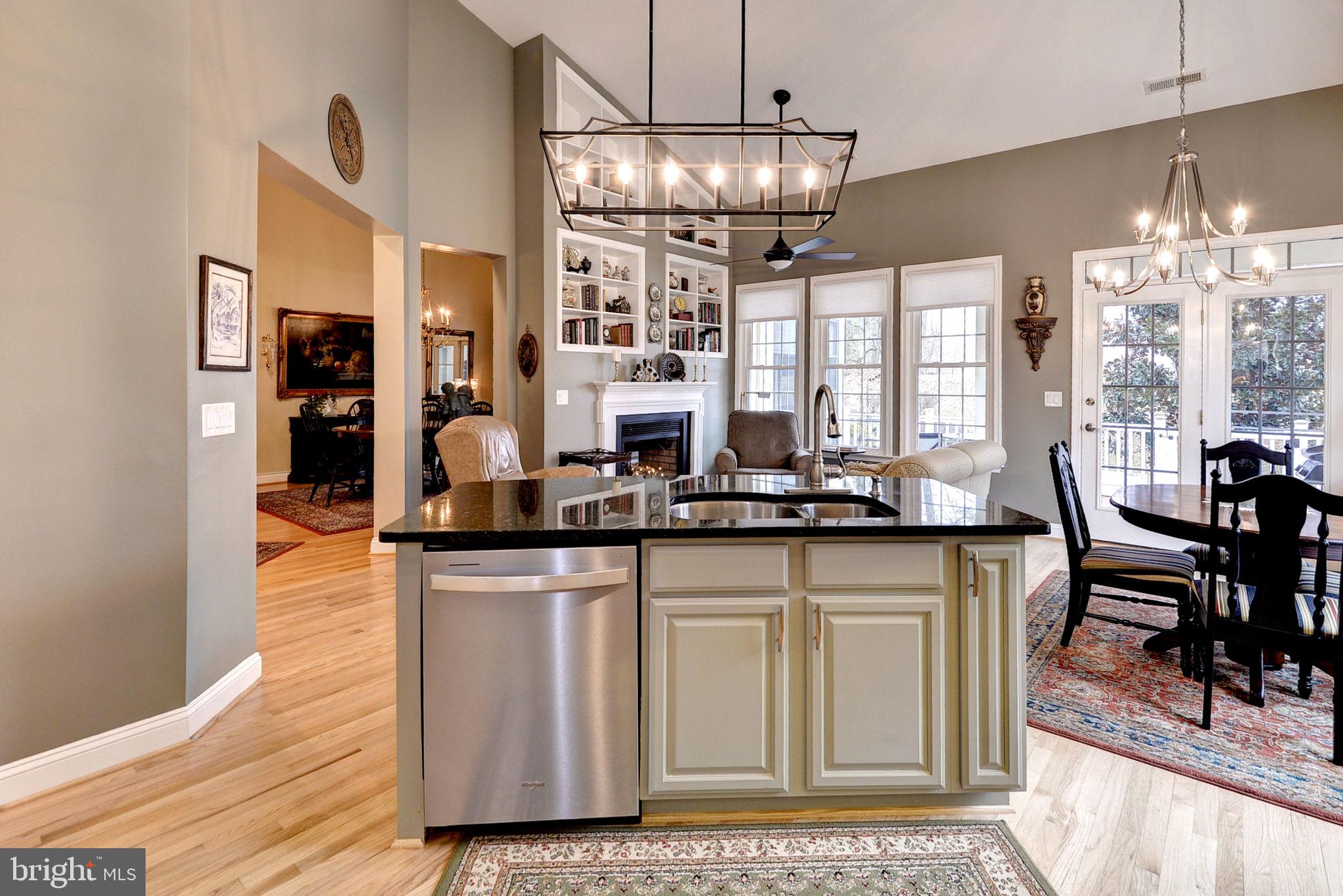 7100 Pinebrook Road Williamsburg, VA 23188 - Photo 27 of 86 a kitchen with granite countertop a stove a sink and a dining table
