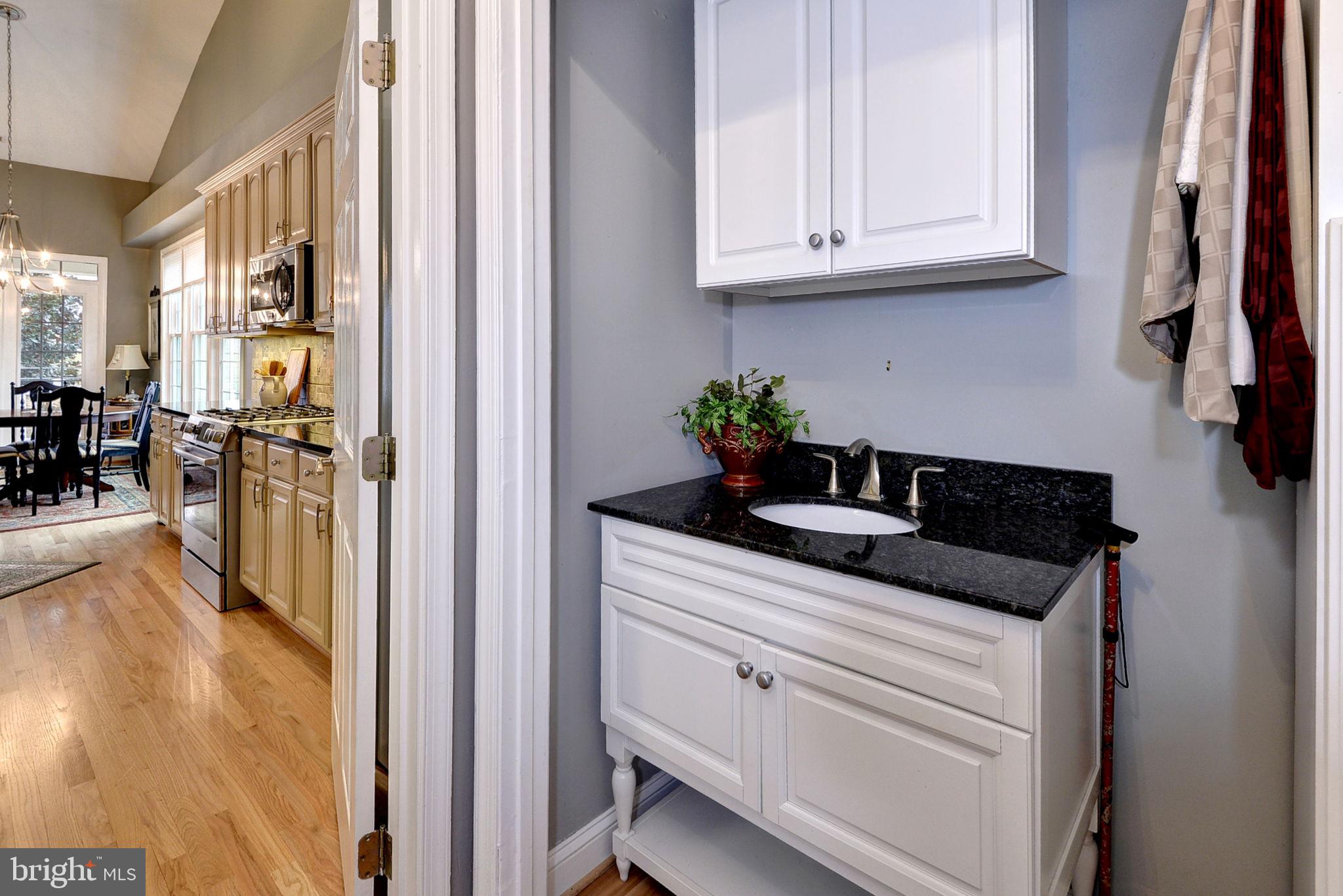 7100 Pinebrook Road Williamsburg, VA 23188 - Photo 31 of 86 a kitchen with stainless steel appliances granite countertop a coffee maker on granite counter tops and white cabinets