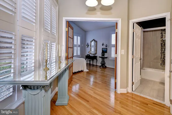 a bedroom with two beds and a chair