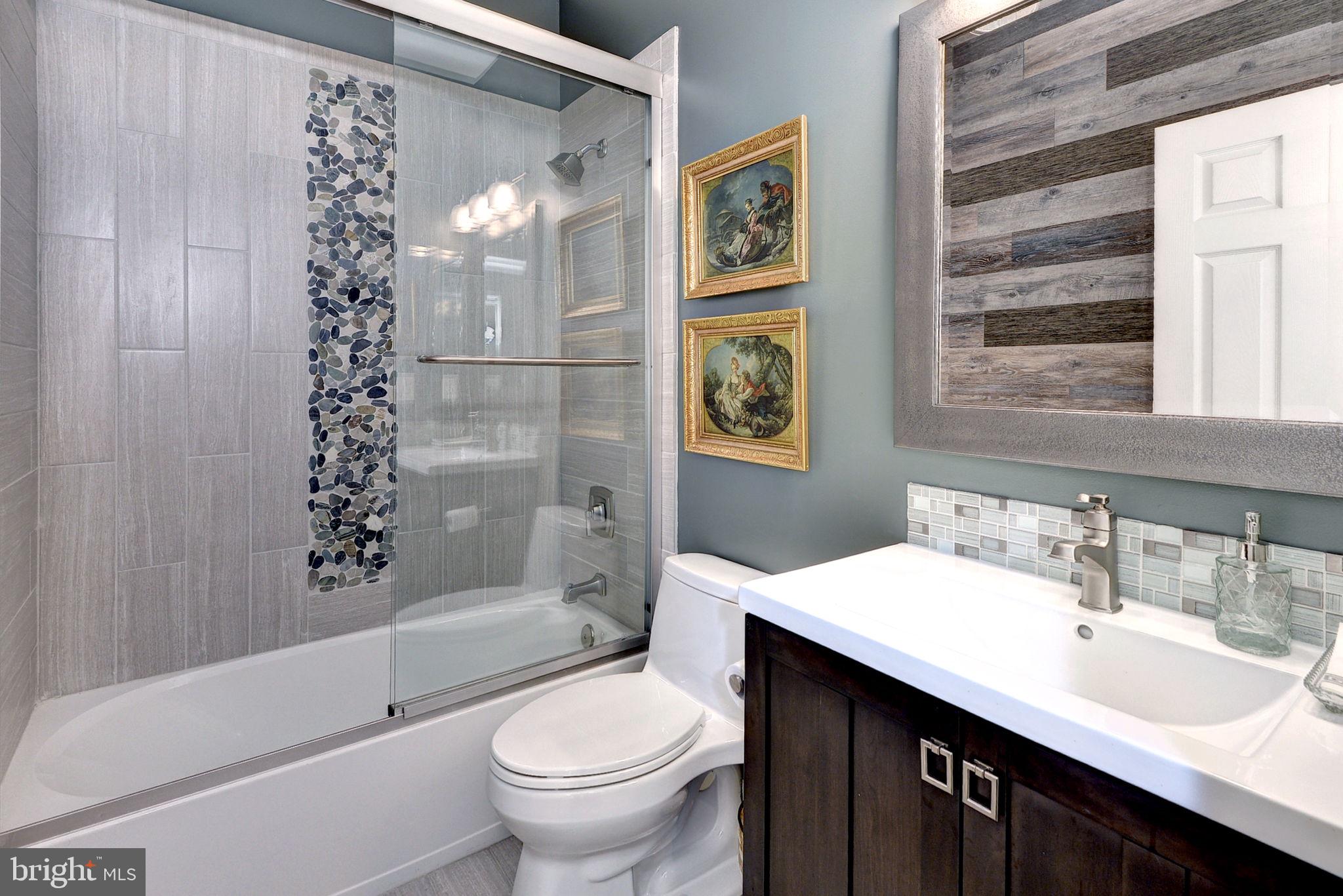 7100 Pinebrook Road Williamsburg, VA 23188 - Photo 34 of 86 a bathroom with a sink toilet and shower