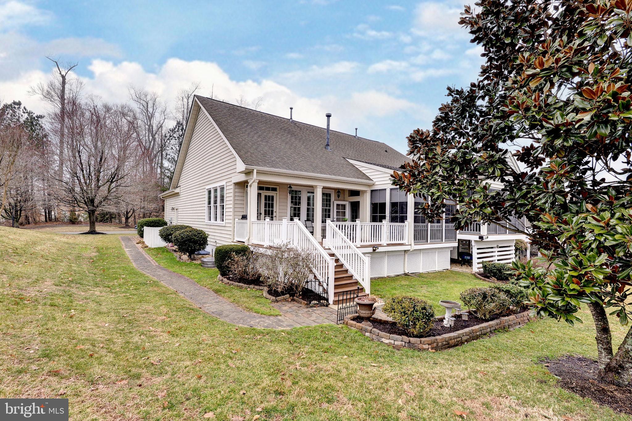 7100 Pinebrook Road Williamsburg, VA 23188 - Photo 57 of 86 a front view of a house with a yard table and chairs
