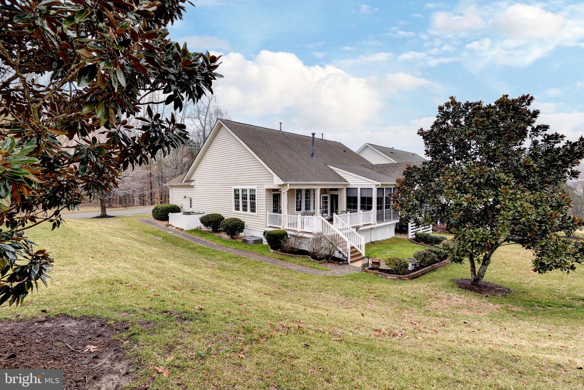 7100 Pinebrook Road Williamsburg, VA 23188 - Photo 60 of 86 a front view of a house with a garden and trees