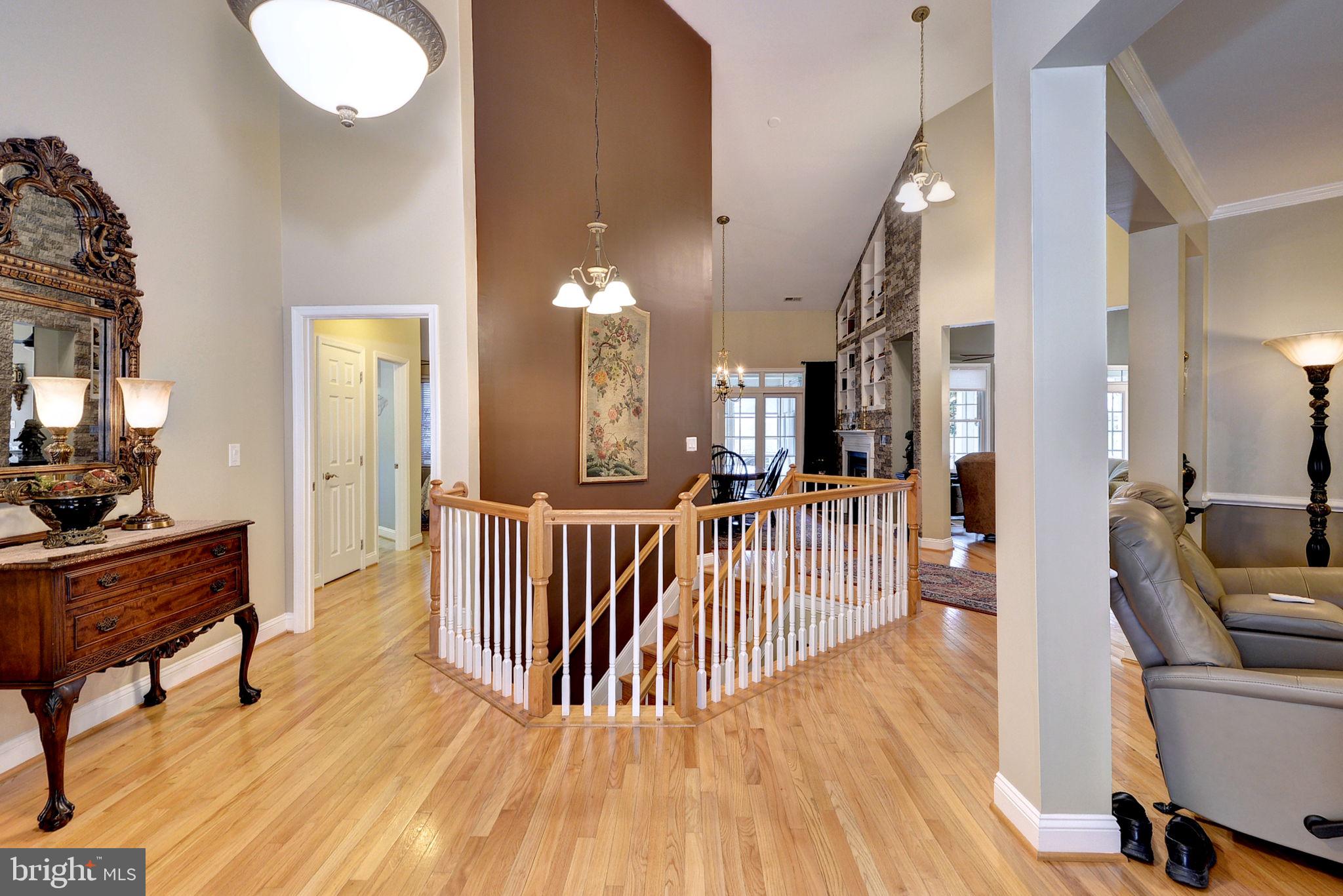 7100 Pinebrook Road Williamsburg, VA 23188 - Photo 10 of 86 a view of a hallway with dining room and wooden floor