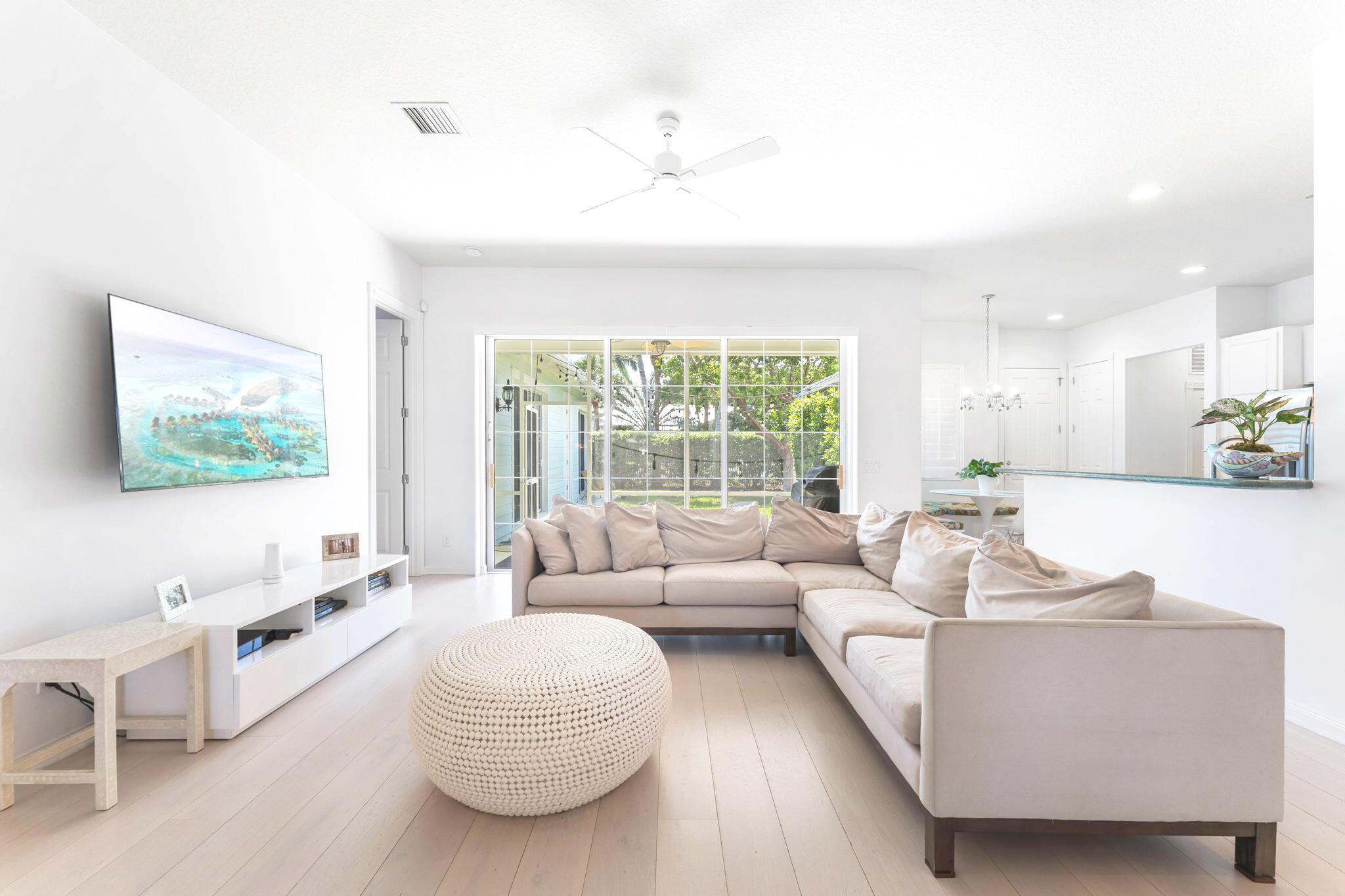 3446 West Mallory Boulevard Jupiter, FL 33458 - Photo 11 of 56 a living room with furniture and a flat screen tv
