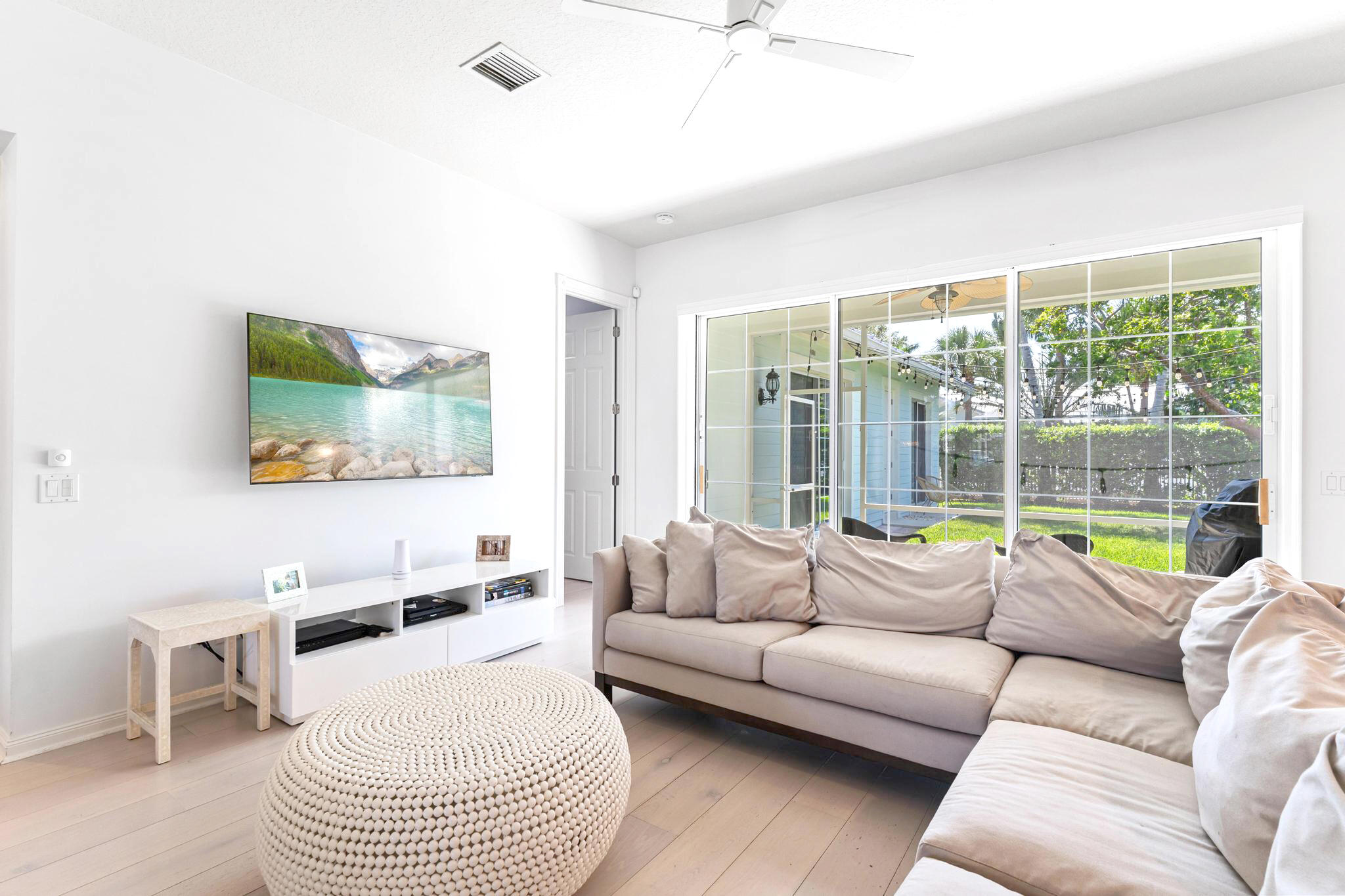 3446 West Mallory Boulevard Jupiter, FL 33458 - Photo 12 of 56 a living room with furniture and a large window