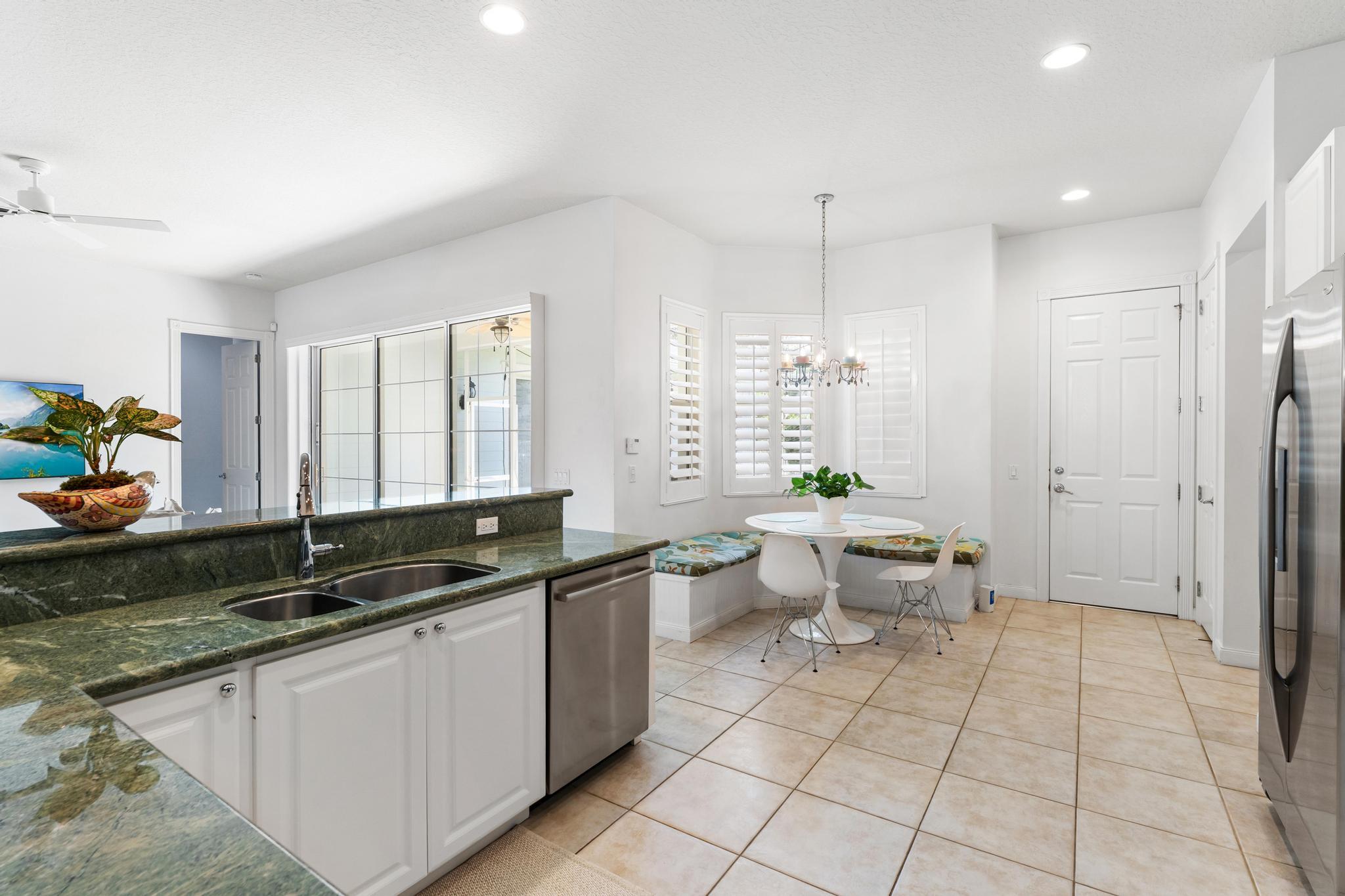 3446 West Mallory Boulevard Jupiter, FL 33458 - Photo 16 of 56 a view of a bathroom with a sink and a toilet
