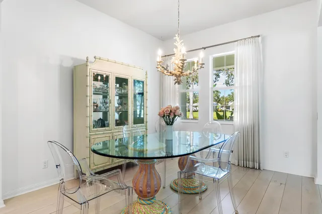 a dining room with furniture and chandelier