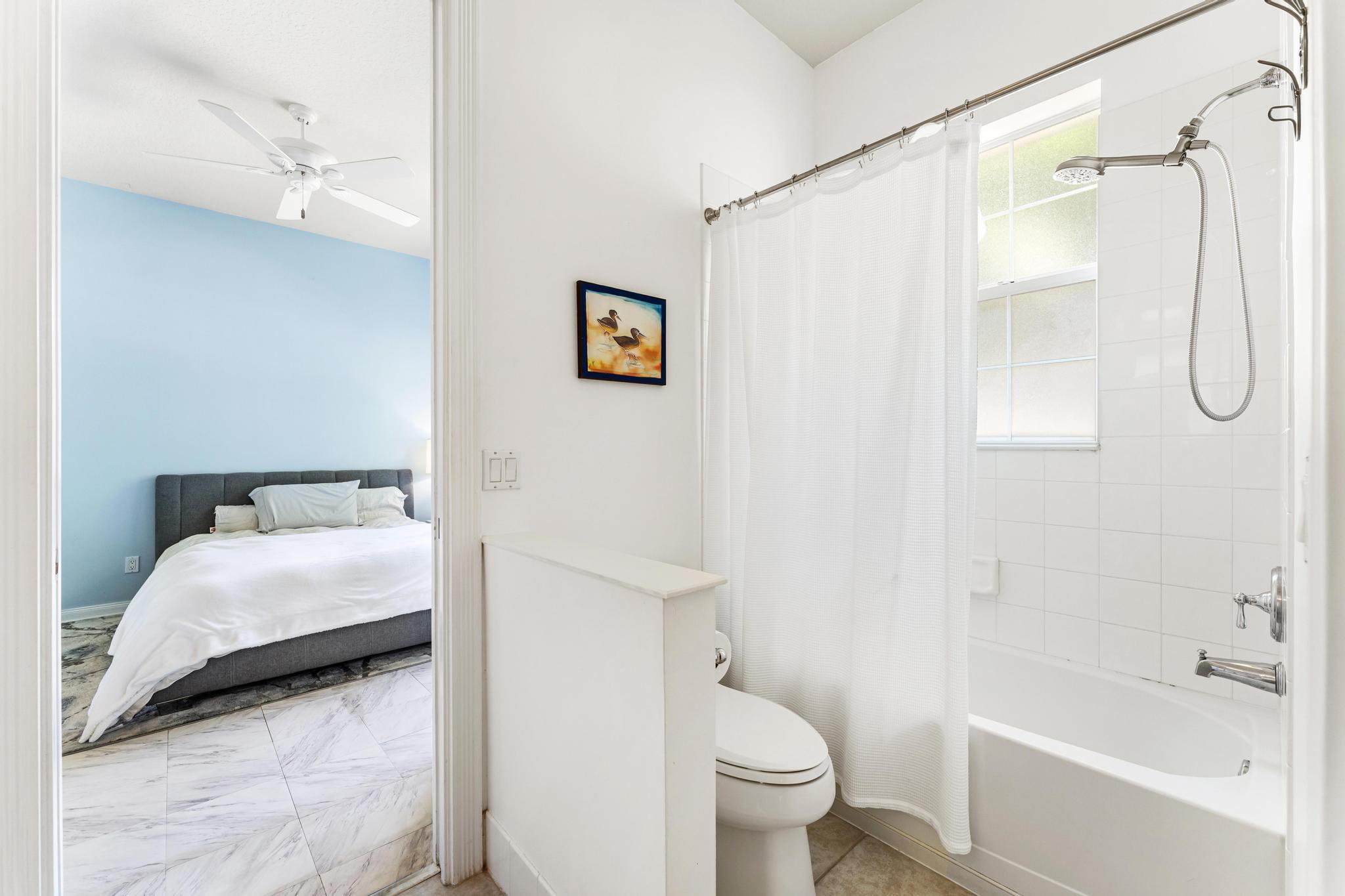 3446 West Mallory Boulevard Jupiter, FL 33458 - Photo 29 of 56 a en suite bathroom with a granite countertop sink a toilet and shower