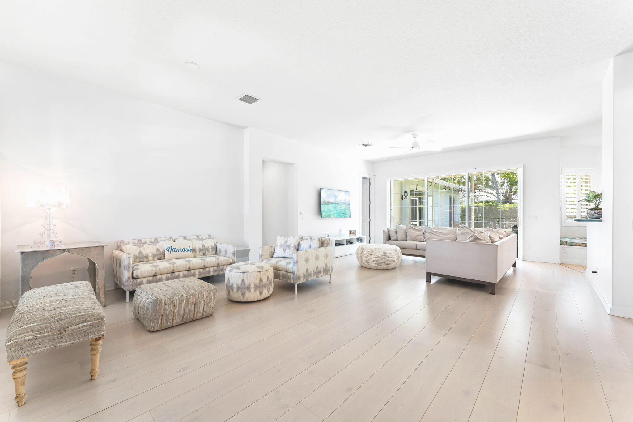3446 West Mallory Boulevard Jupiter, FL 33458 - Photo 3 of 56 a living room with furniture and a large window