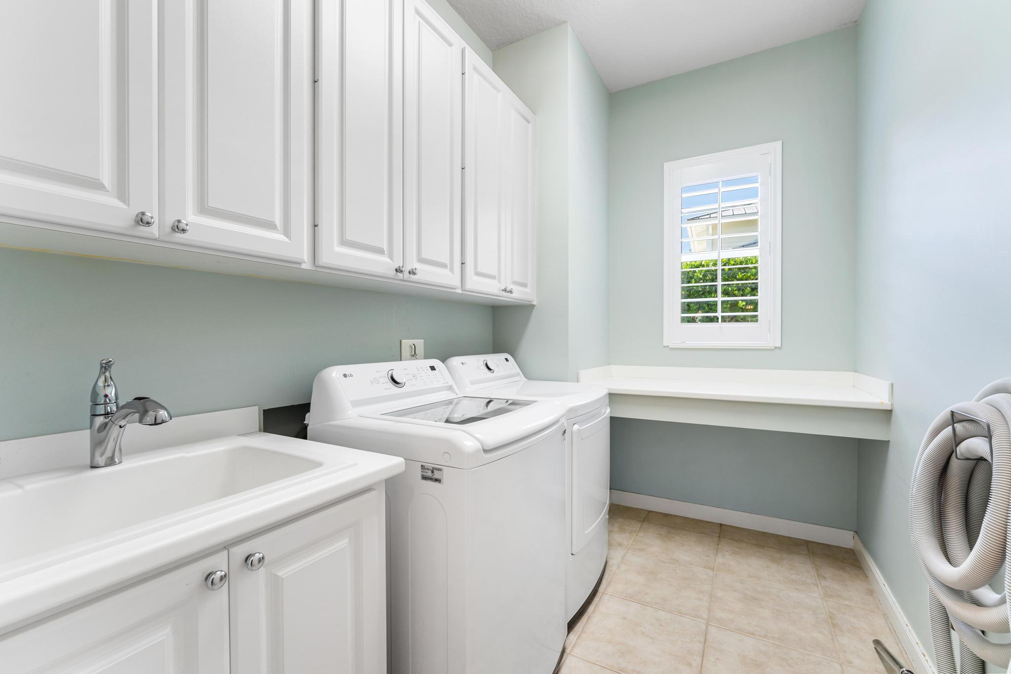 3446 West Mallory Boulevard Jupiter, FL 33458 - Photo 33 of 56 a utility room with dryer and washer