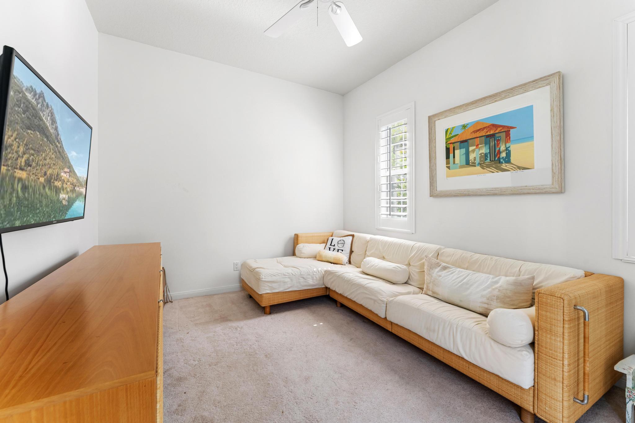 3446 West Mallory Boulevard Jupiter, FL 33458 - Photo 34 of 56 a living room with furniture and a window