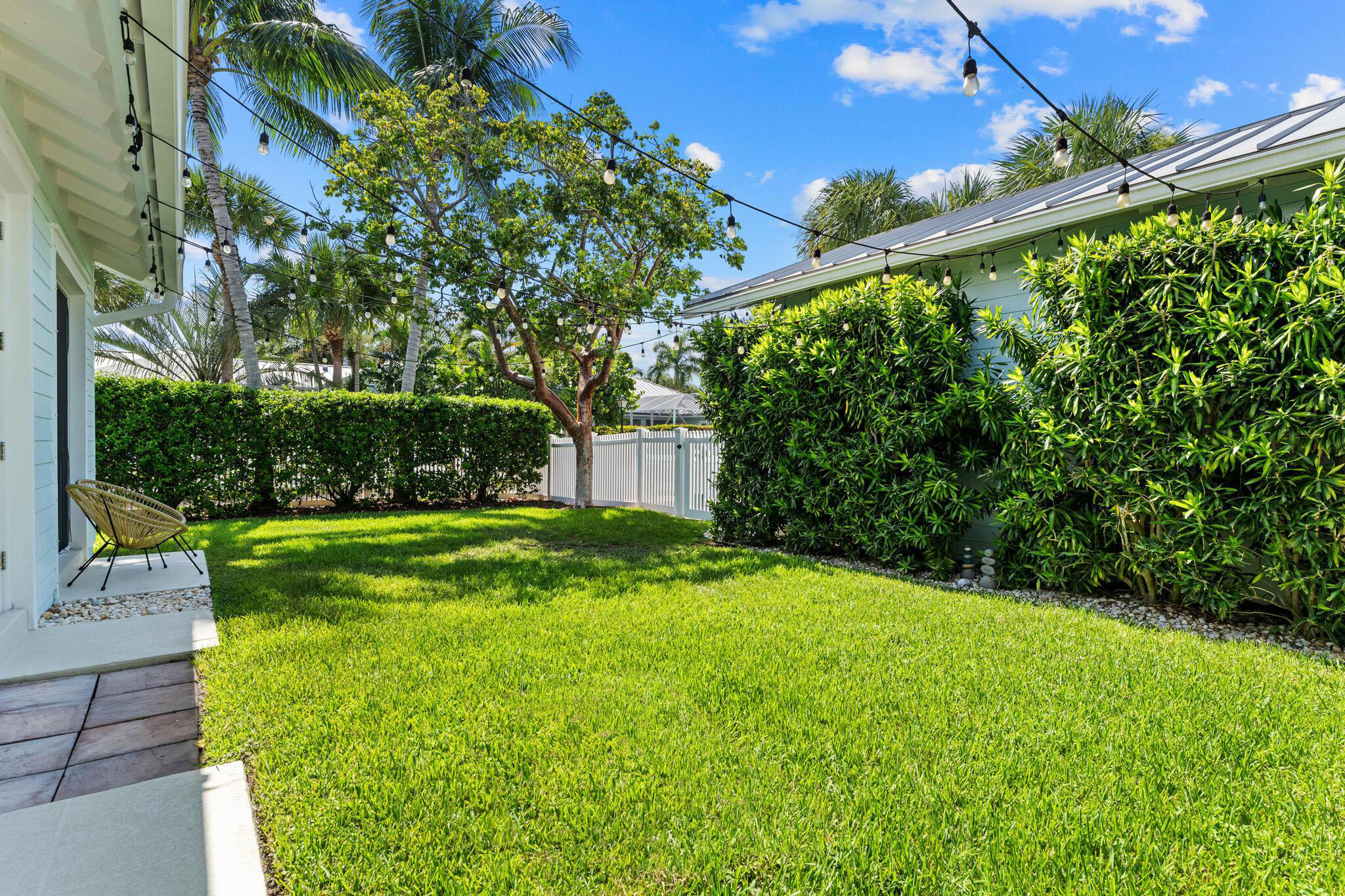 3446 West Mallory Boulevard Jupiter, FL 33458 - Photo 37 of 56 a view of yard with swimming pool and green space