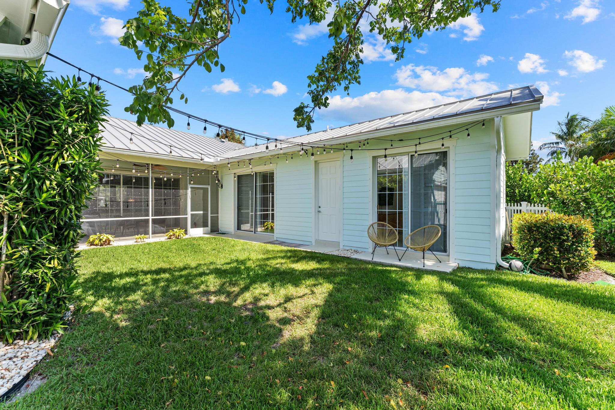 3446 West Mallory Boulevard Jupiter, FL 33458 - Photo 39 of 56 a view of a house with a yard