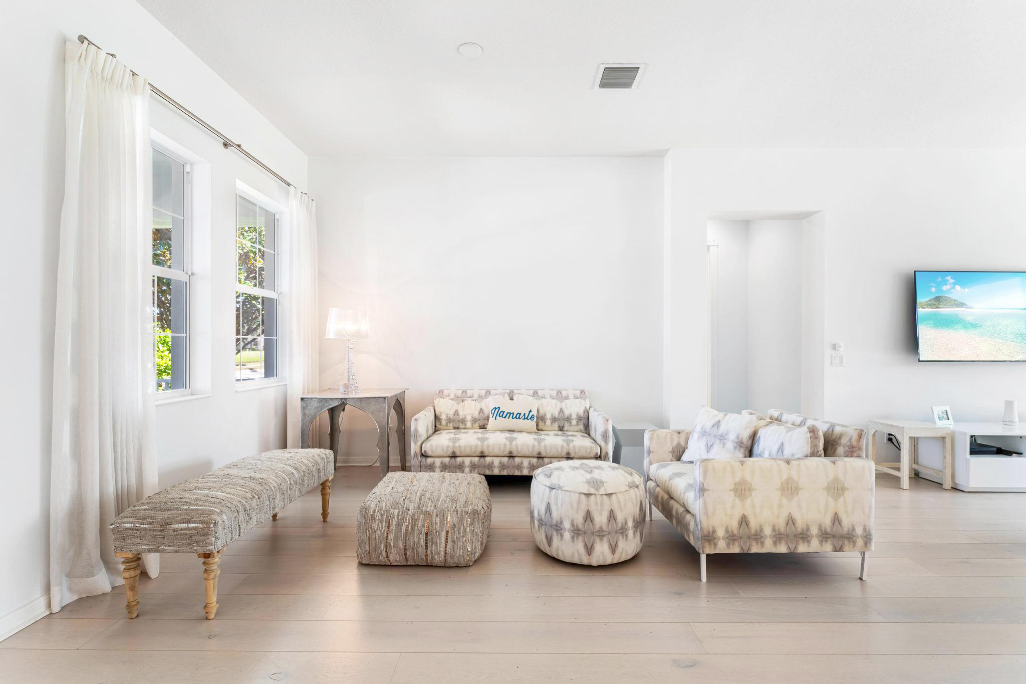 3446 West Mallory Boulevard Jupiter, FL 33458 - Photo 4 of 56 a bedroom with furniture and a large window