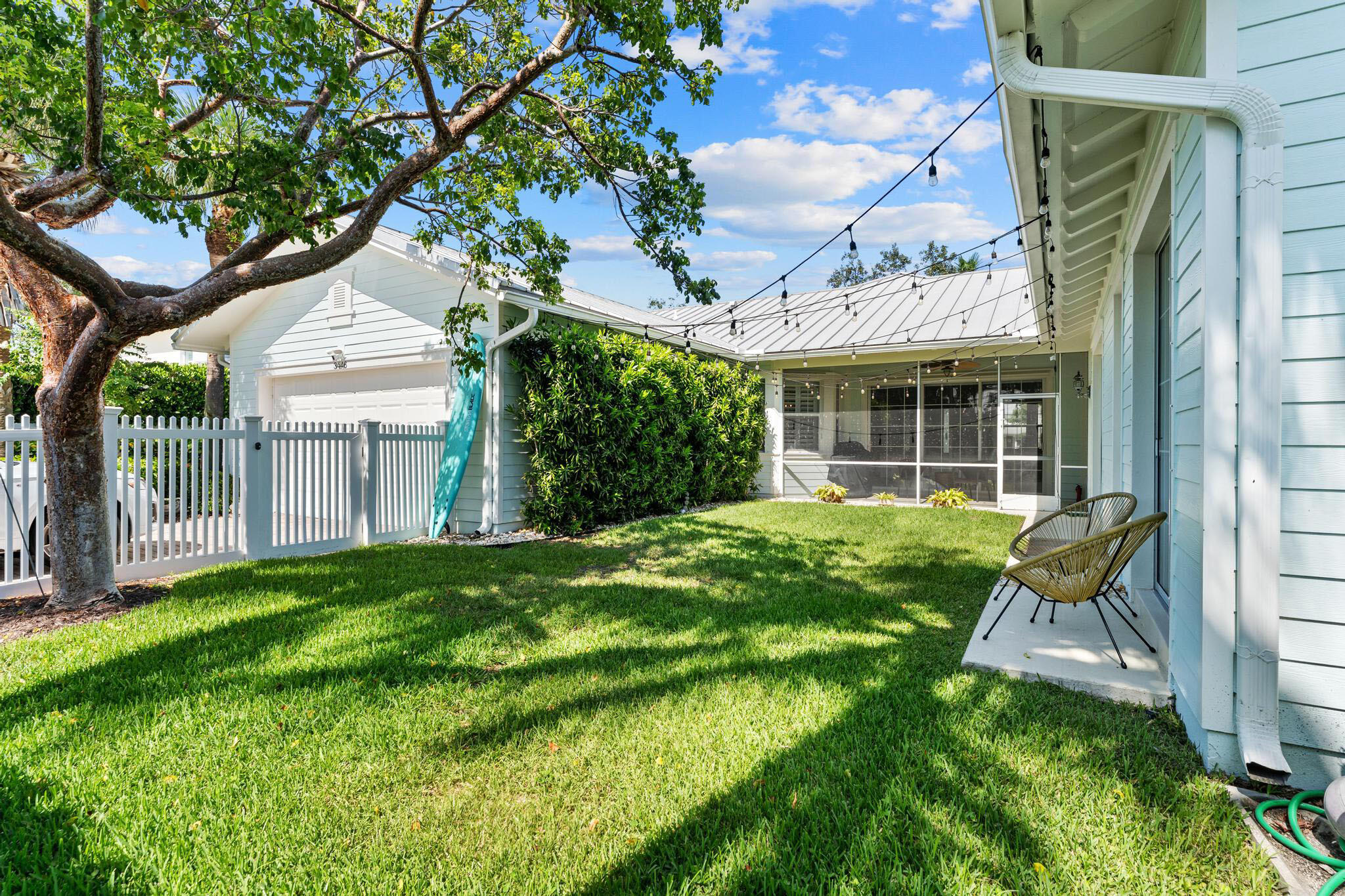 3446 West Mallory Boulevard Jupiter, FL 33458 - Photo 41 of 56 a view of backyard with a garden and plants