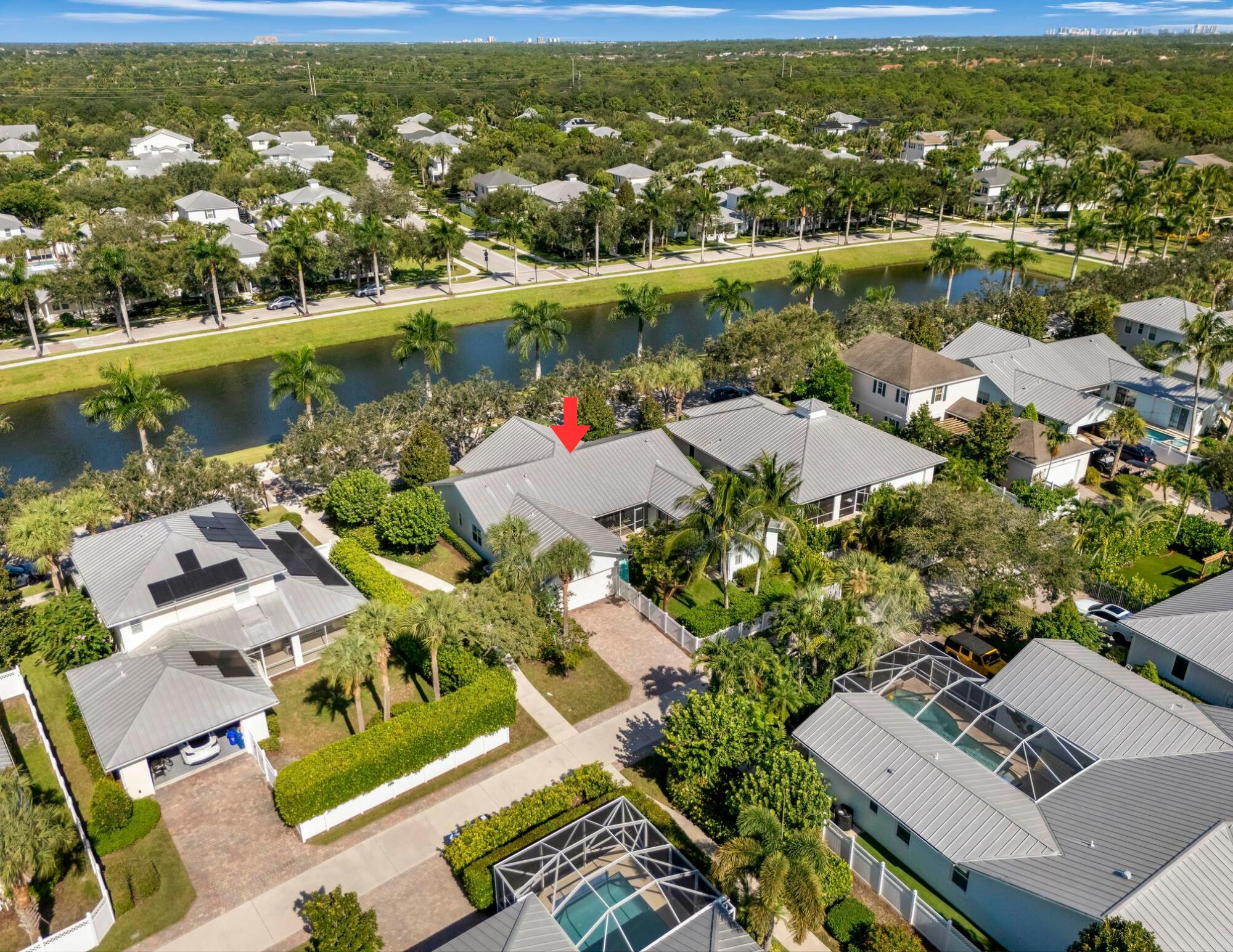 3446 West Mallory Boulevard Jupiter, FL 33458 - Photo 48 of 56 an aerial view of residential houses with outdoor space and river