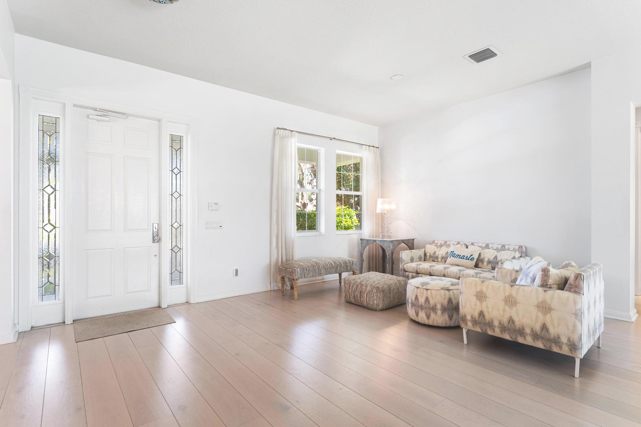 3446 West Mallory Boulevard Jupiter, FL 33458 - Photo 5 of 56 a bedroom with furniture and wooden floor