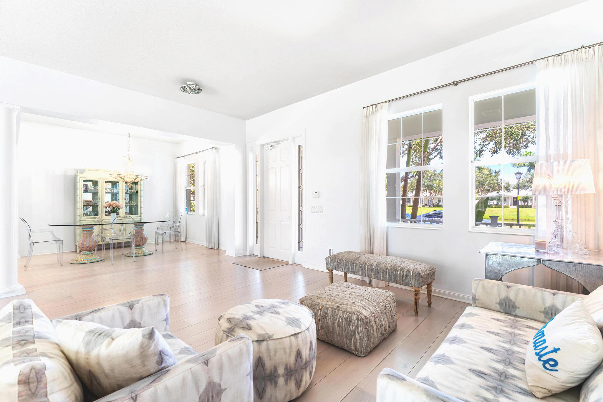 3446 West Mallory Boulevard Jupiter, FL 33458 - Photo 6 of 56 a living room with furniture and a large window
