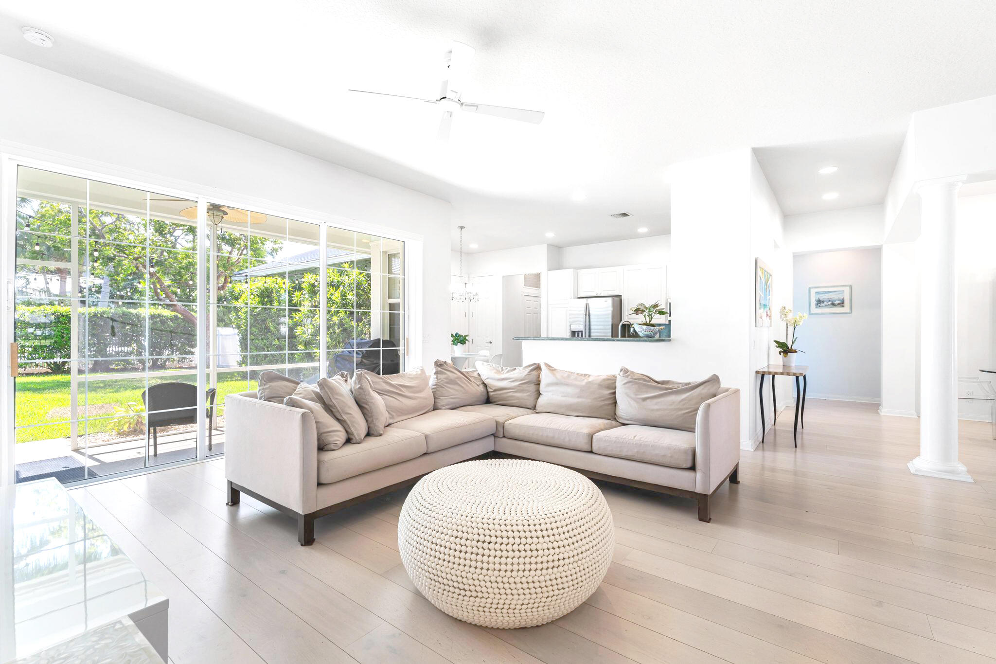 3446 West Mallory Boulevard Jupiter, FL 33458 - Photo 7 of 56 a living room with furniture and a large window