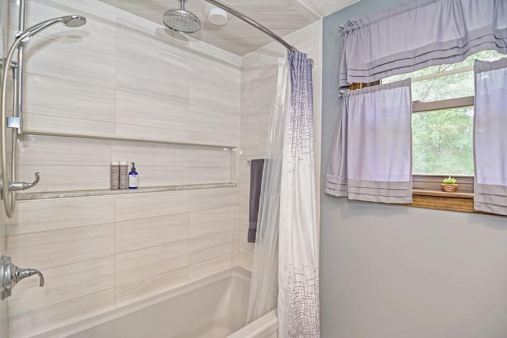 45 Frank Road Stoughton, MA 02072 - Photo 13 of 41 a bathroom with a bathtub and a shower