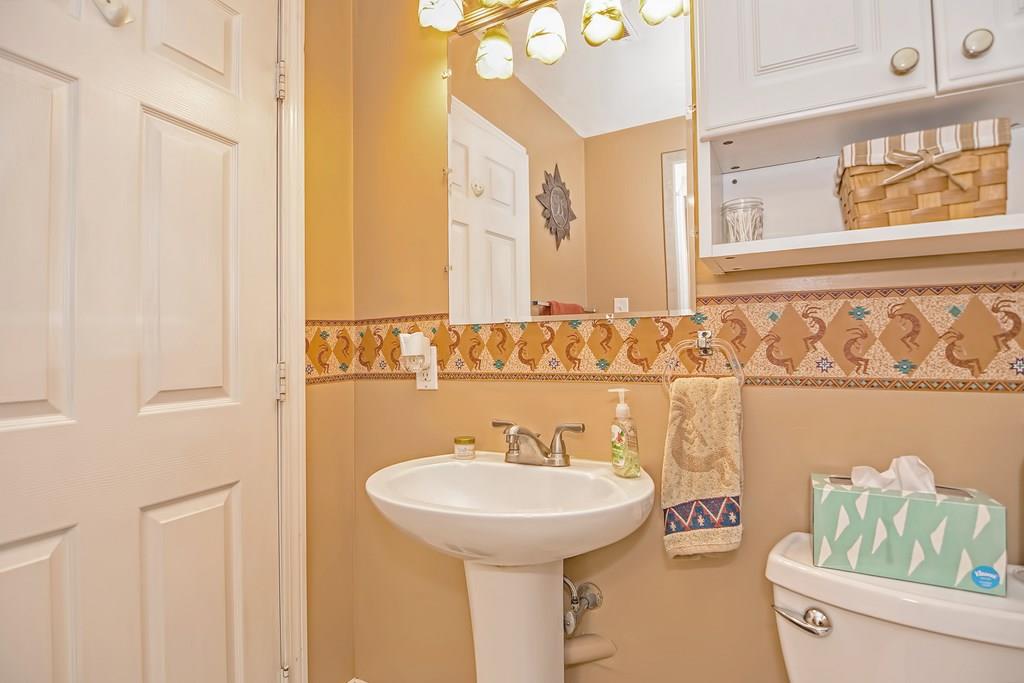 45 Frank Road Stoughton, MA 02072 - Photo 14 of 41 a bathroom with a sink and a mirror