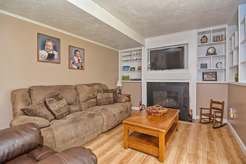 45 Frank Road Stoughton, MA 02072 - Photo 29 of 41 a living room with furniture and a fireplace