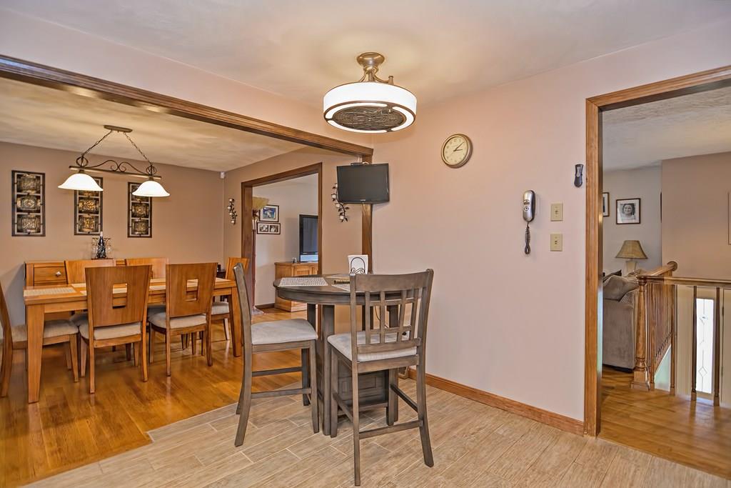 45 Frank Road Stoughton, MA 02072 - Photo 3 of 41 a view of a dining room with furniture and wooden floor