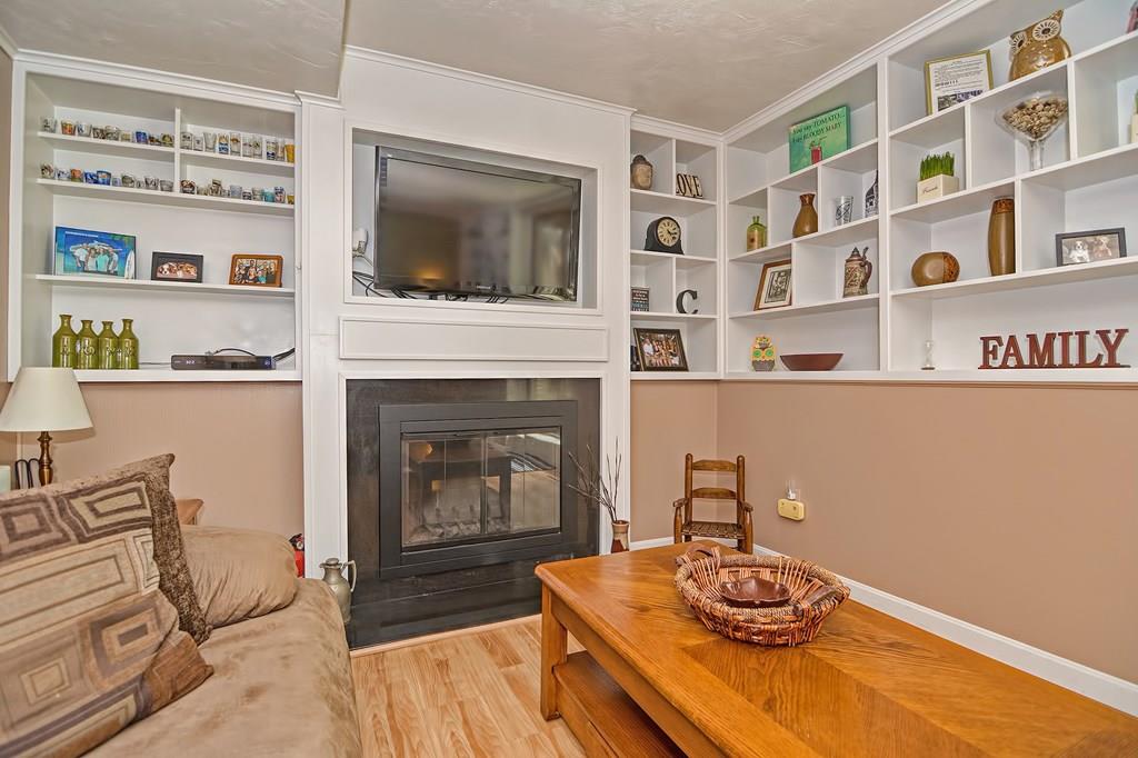 45 Frank Road Stoughton, MA 02072 - Photo 33 of 41 a living room with furniture and a fireplace