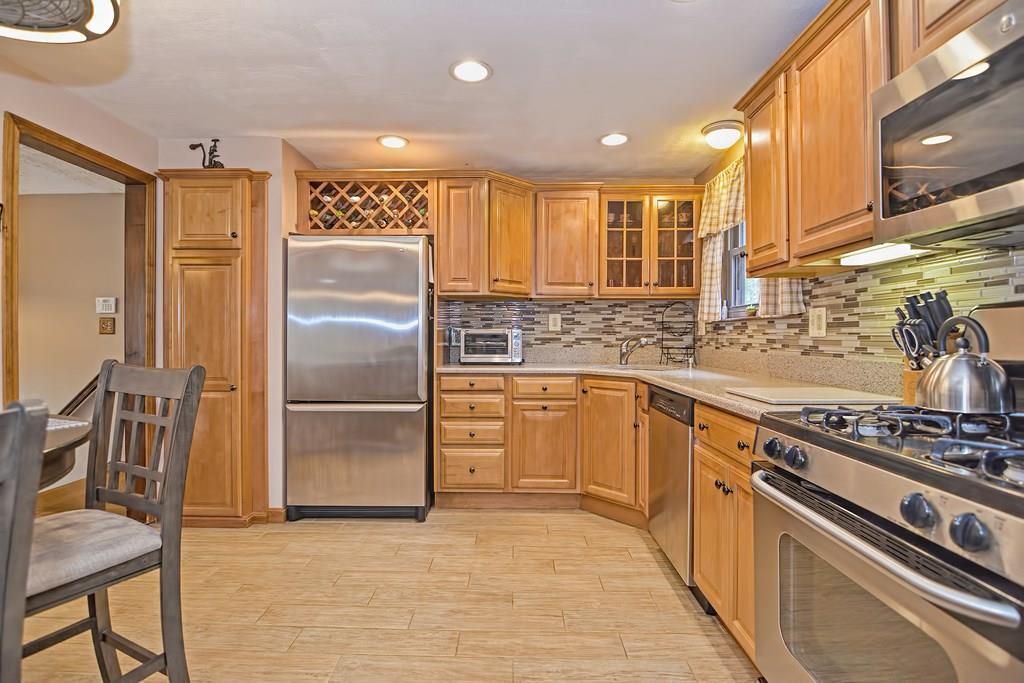 45 Frank Road Stoughton, MA 02072 - Photo 4 of 41 a kitchen with cabinets and stainless steel appliances