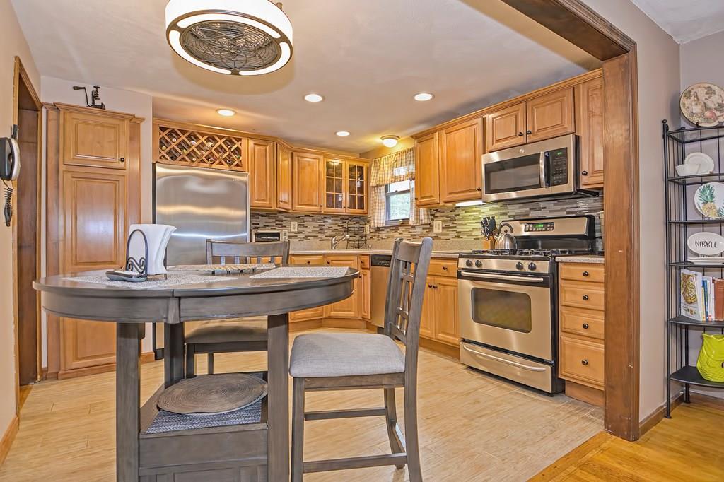 45 Frank Road Stoughton, MA 02072 - Photo 6 of 41 a kitchen with a stove and a refrigerator